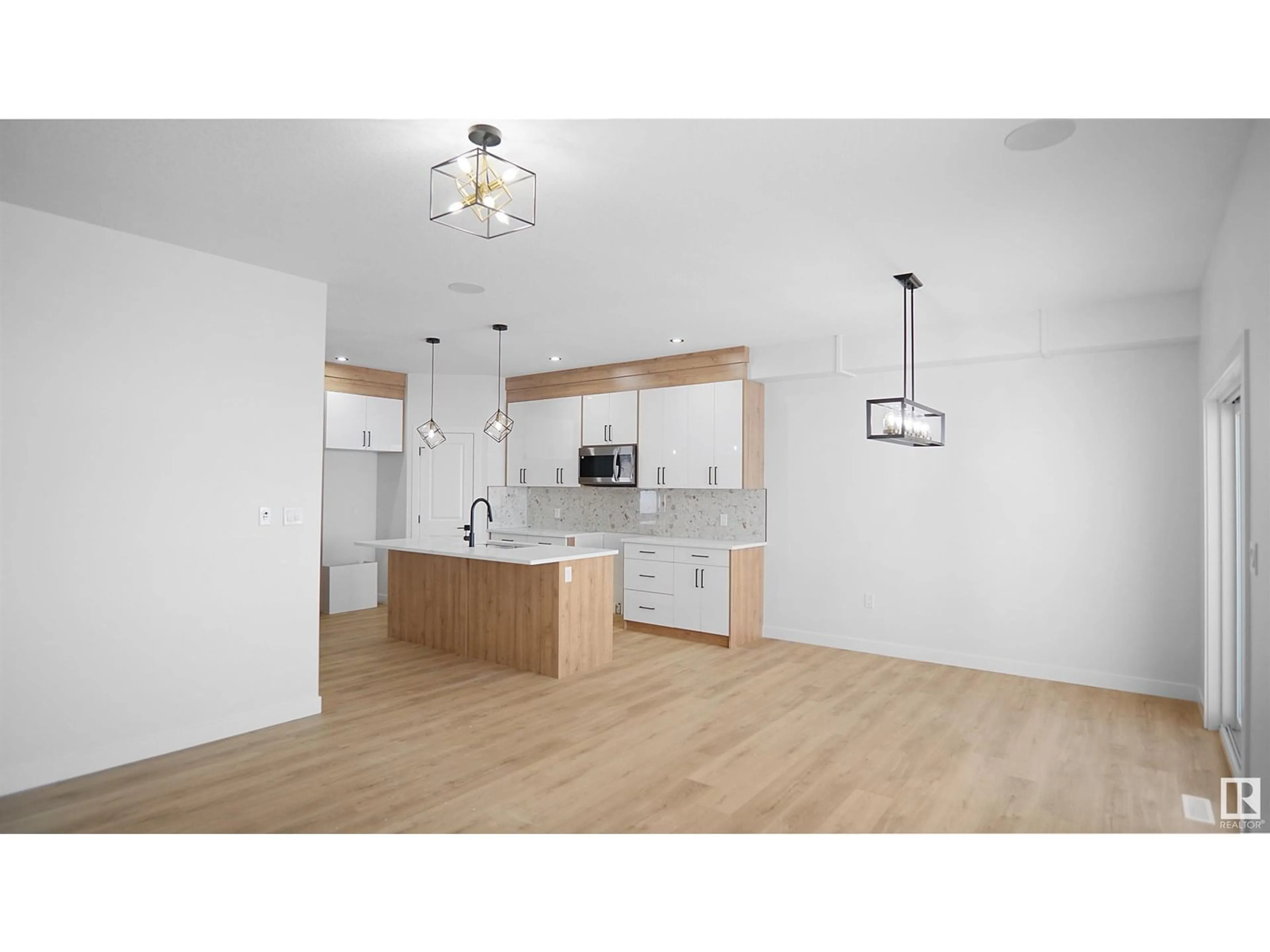 Open concept kitchen, wood/laminate floor for 4 AXELWOOD CRESENT, Spruce Grove Alberta T7X3C6