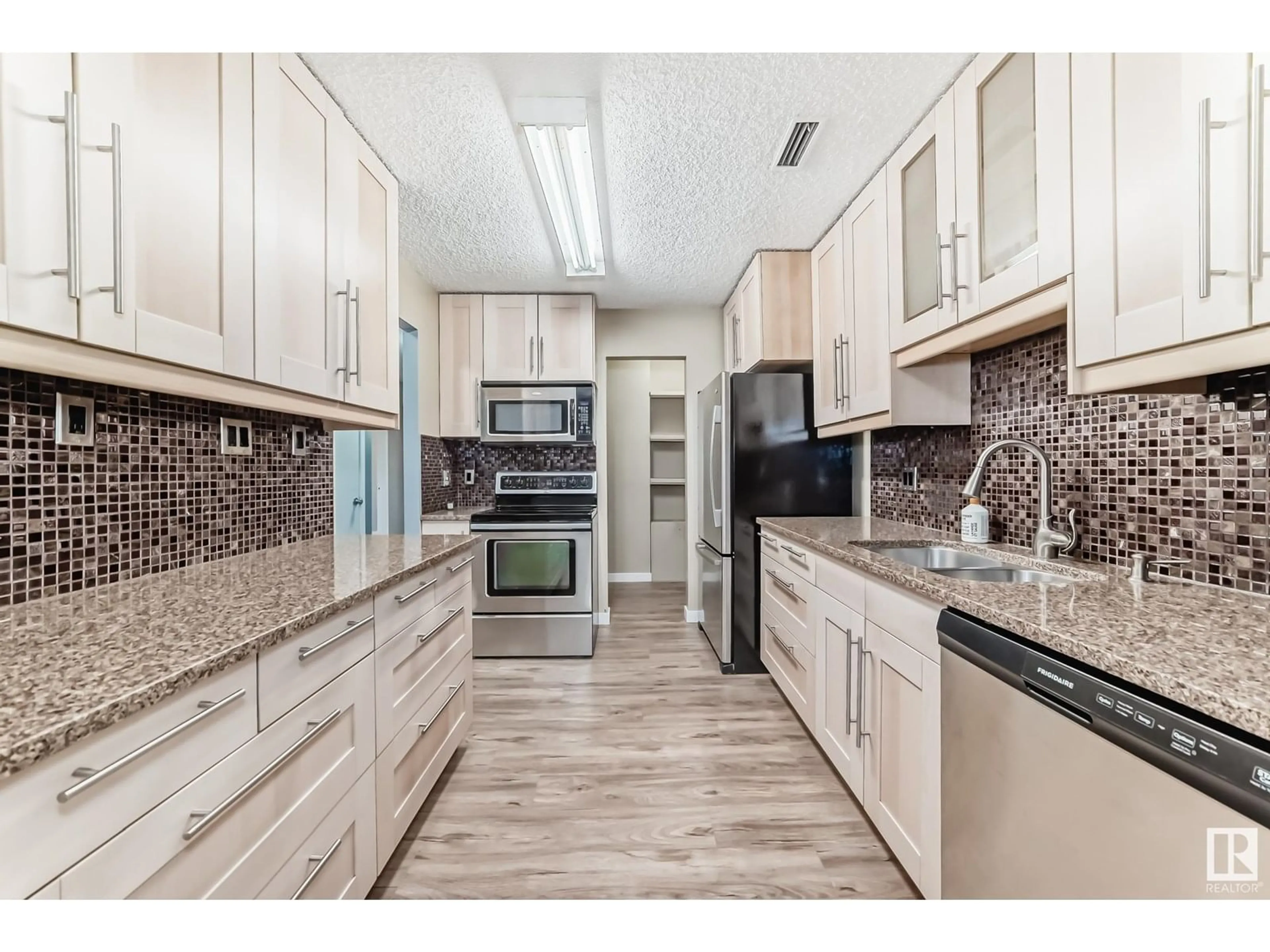 Open concept kitchen, ceramic/tile floor for #11 - 3111 142 AV, Edmonton Alberta T5Y2H6