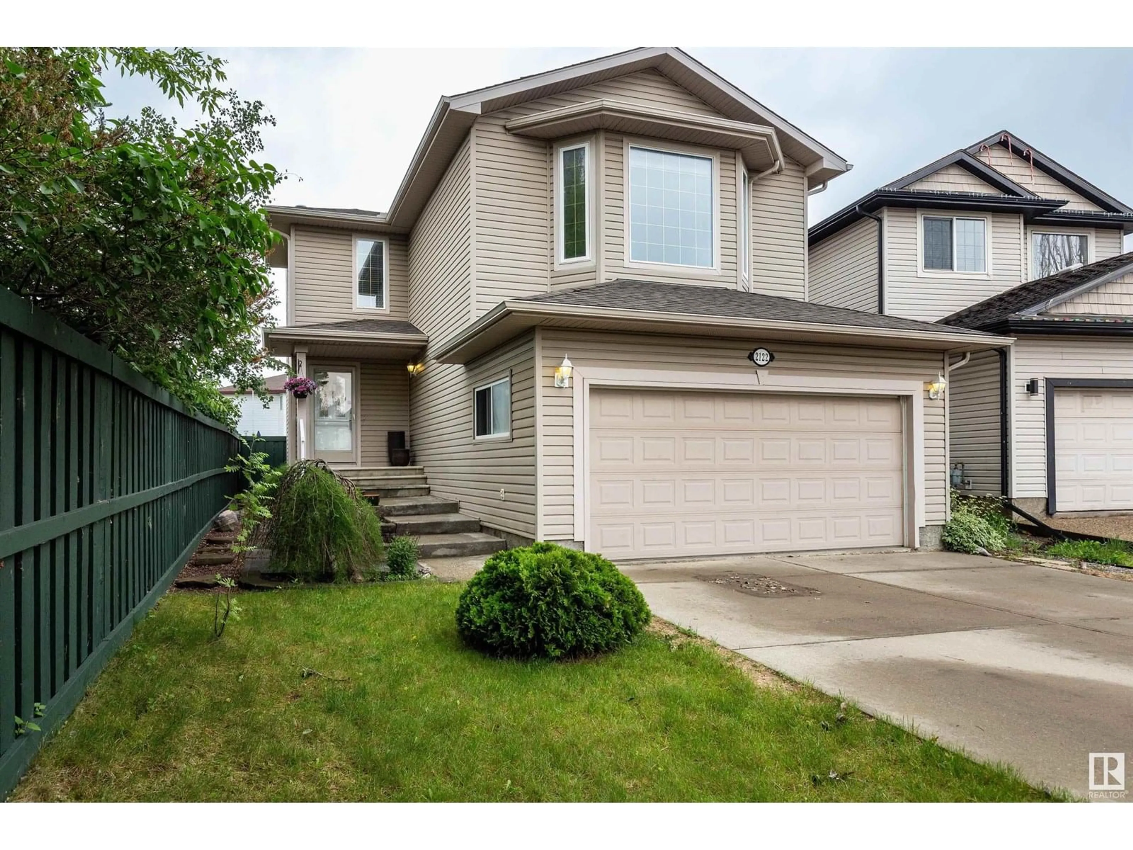 Home with vinyl exterior material, street for 2122 GARNETT PL, Edmonton Alberta T5T6R5