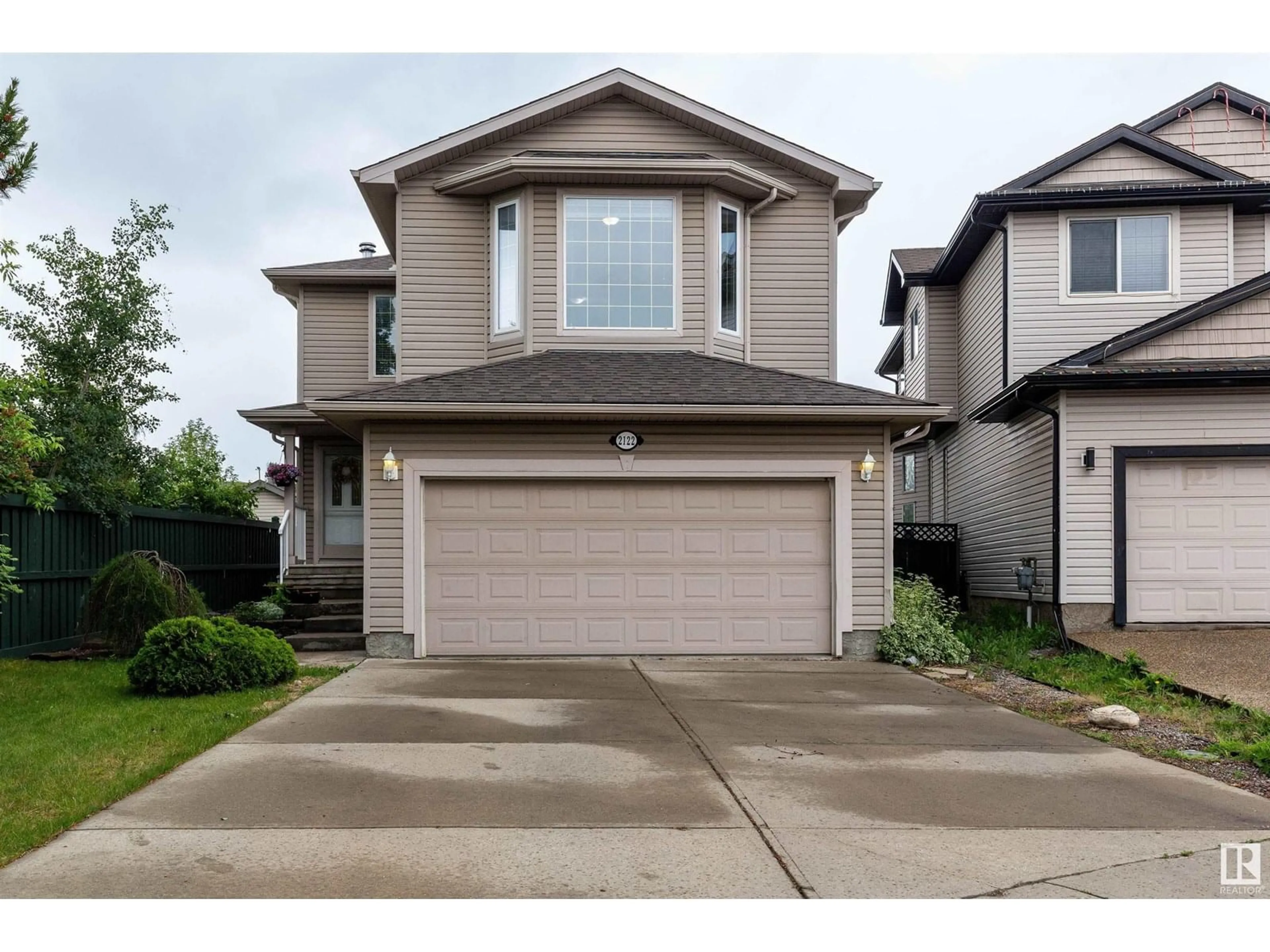 Home with vinyl exterior material, street for 2122 GARNETT PL, Edmonton Alberta T5T6R5