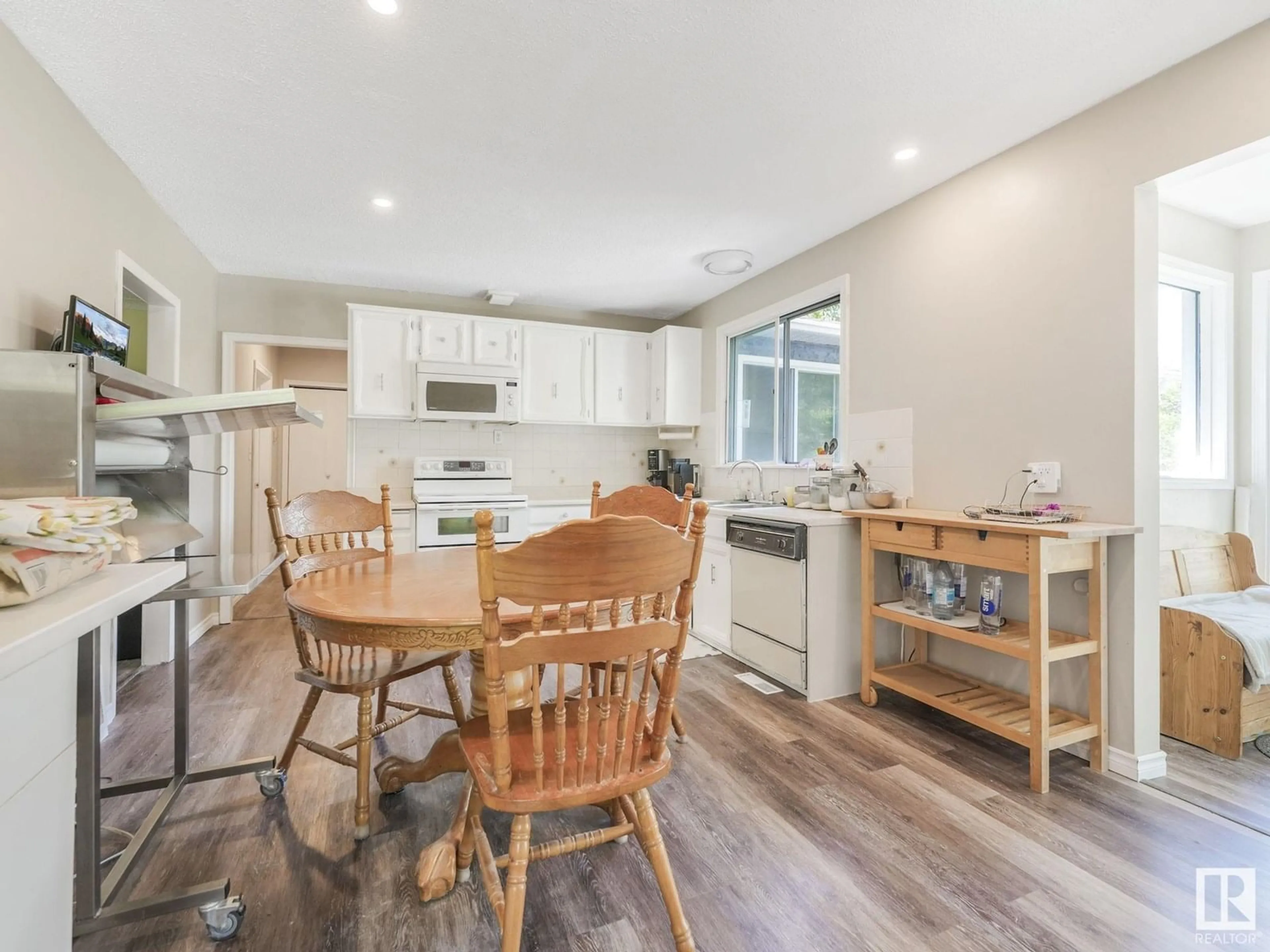 Open concept kitchen, wood/laminate floor for 14 22322 WYE RD, Rural Strathcona County Alberta T8A4S9