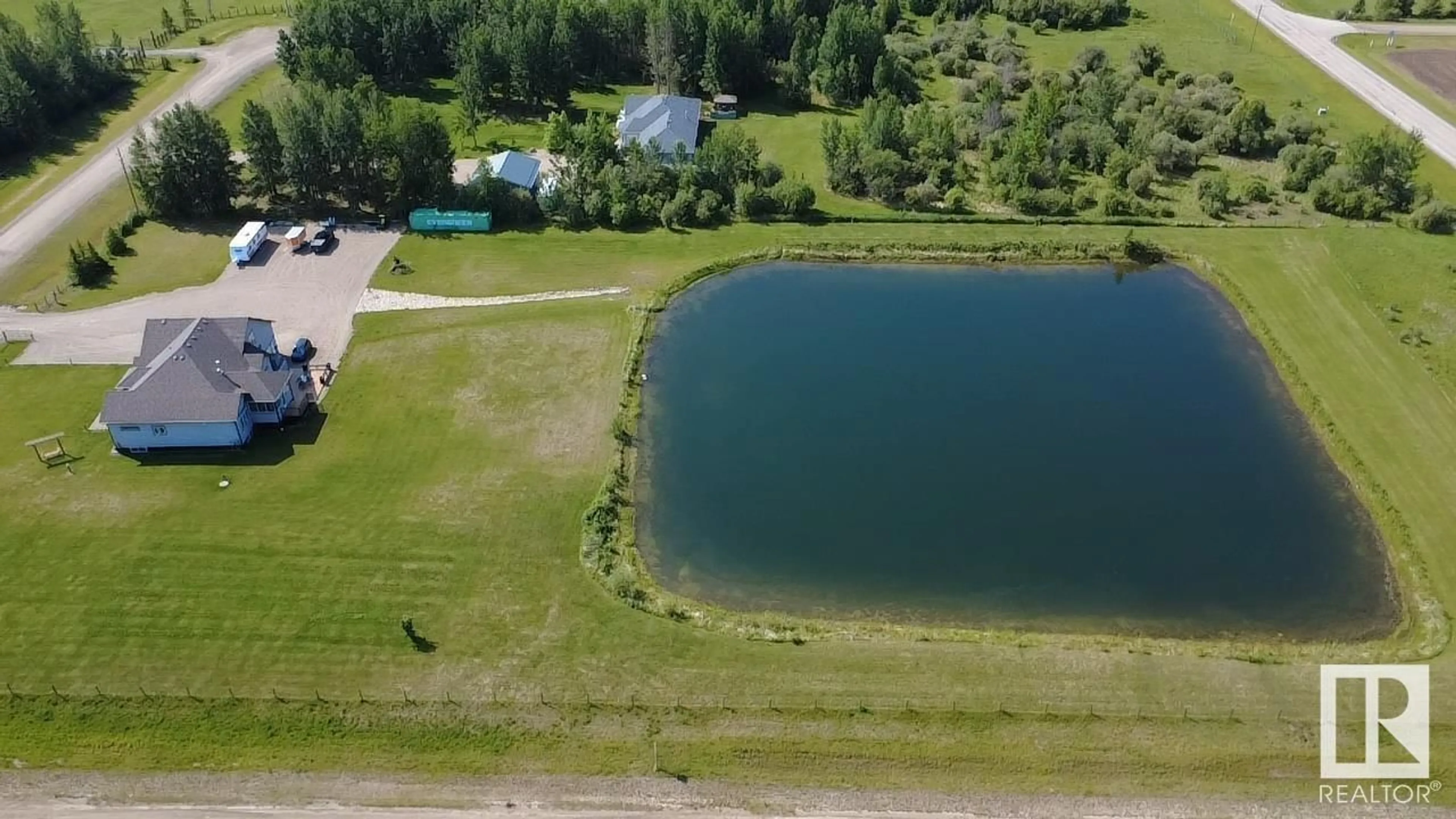 A pic from outside/outdoor area/front of a property/back of a property/a pic from drone, water/lake/river/ocean view for #102 - 49413 RGE ROAD 81, Rural Brazeau County Alberta T7A1S6