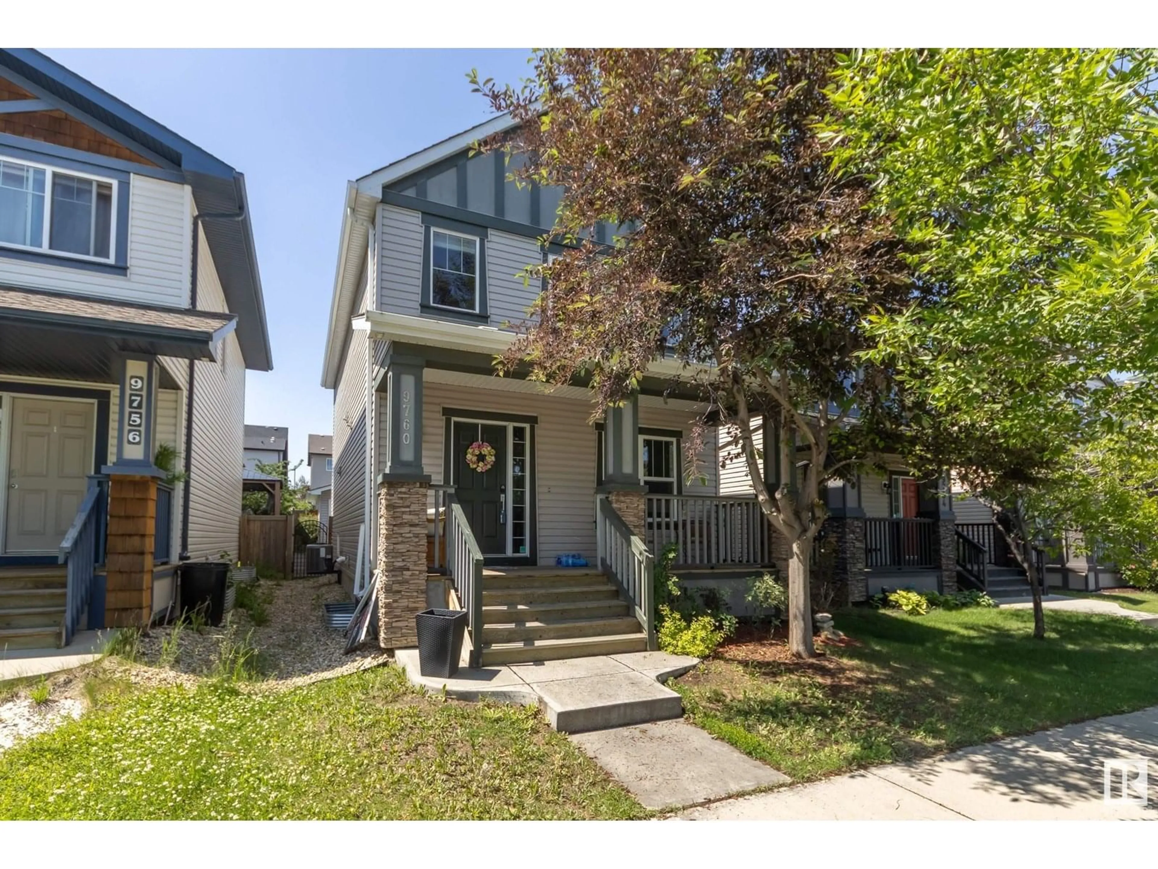 Home with vinyl exterior material, street for NW - 9760 220 ST, Edmonton Alberta T5T4J9