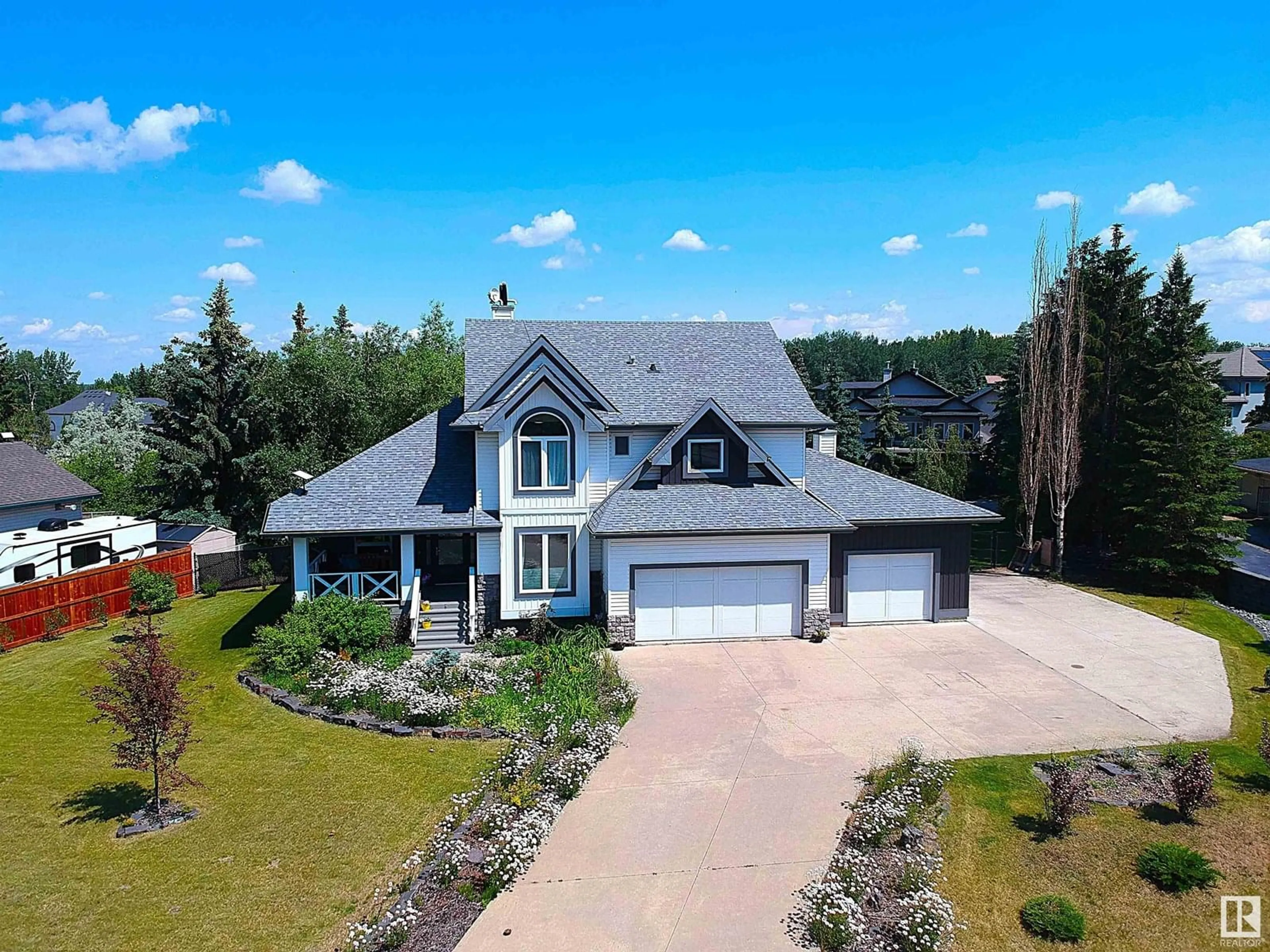 A pic from outside/outdoor area/front of a property/back of a property/a pic from drone, unknown for #302 - 53302 RANGE ROAD 261, Rural Parkland County Alberta T7Y1A7