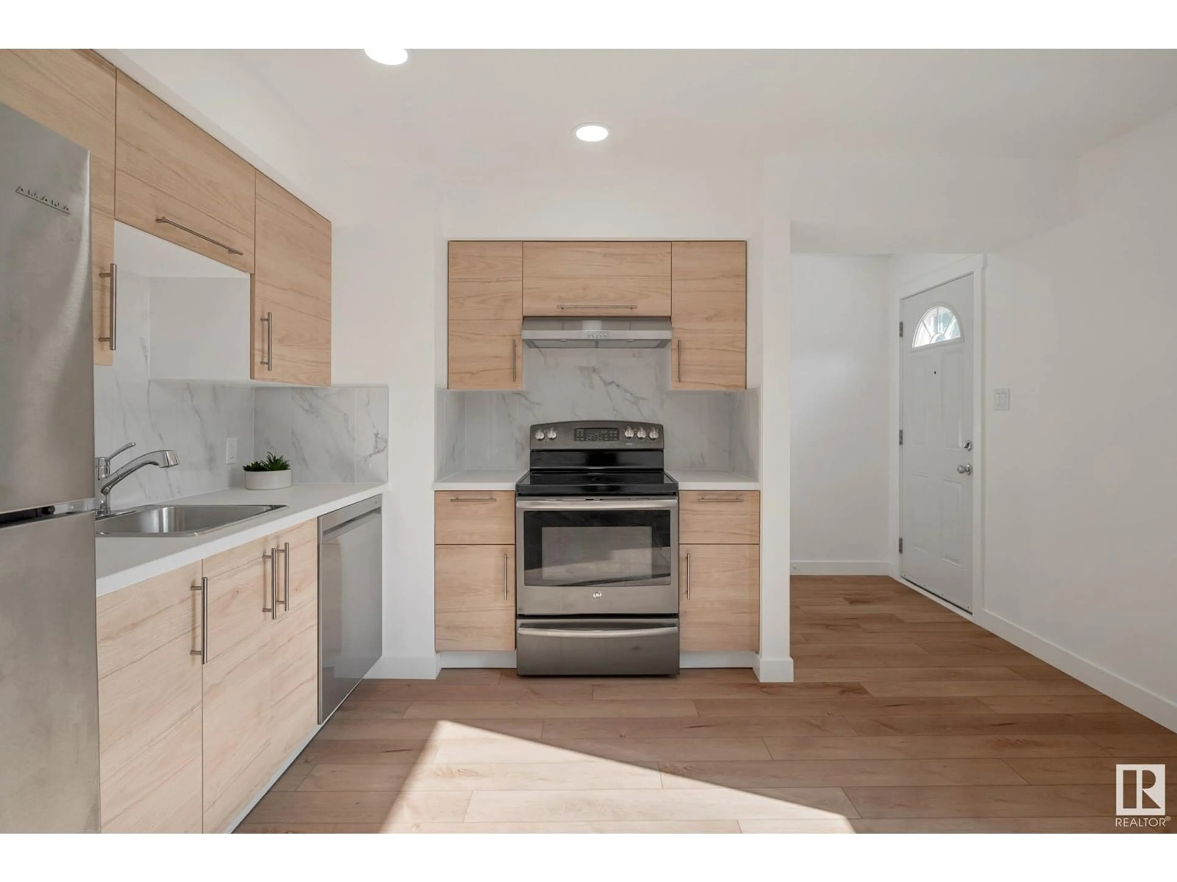 Open concept kitchen, wood/laminate floor for 138 MAYFAIR MEWS, Edmonton Alberta T5E5R7