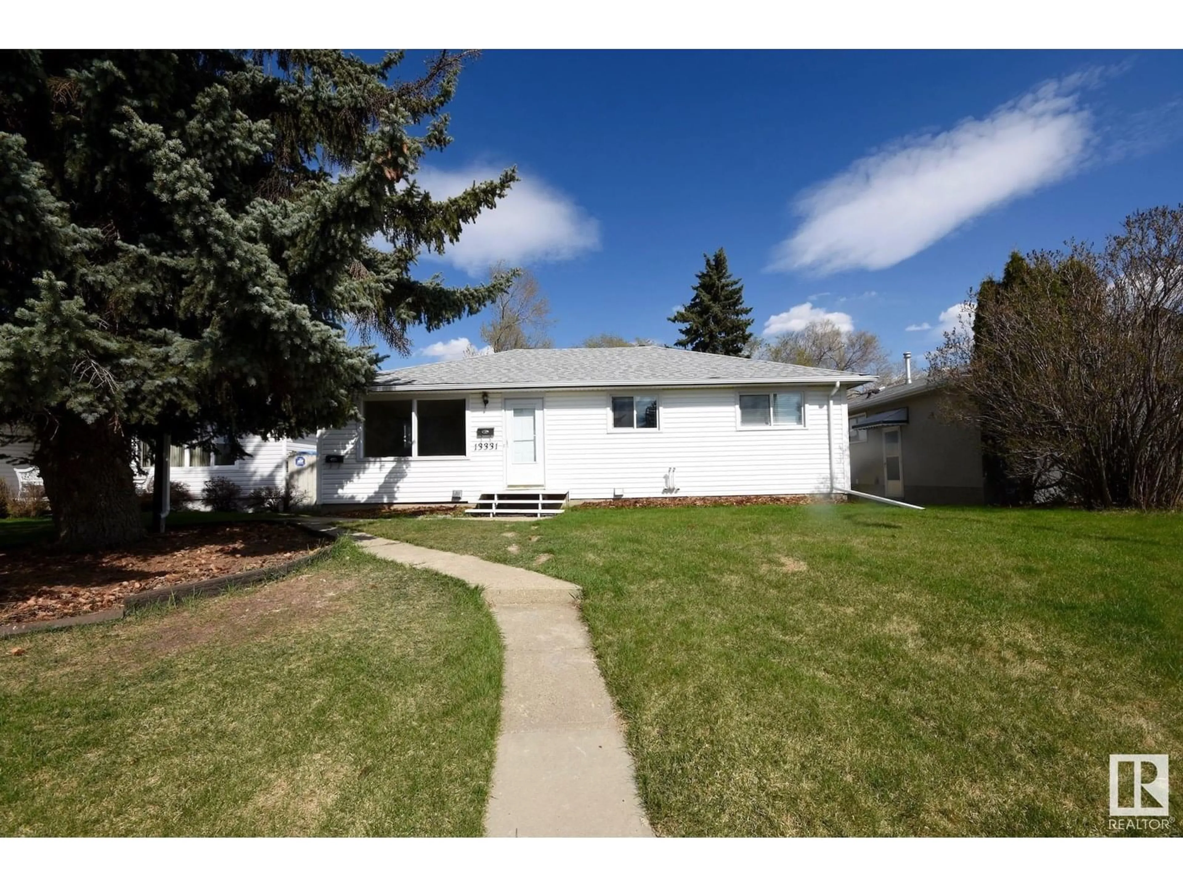 Home with vinyl exterior material, street for 13331 131 ST, Edmonton Alberta T5L1N8
