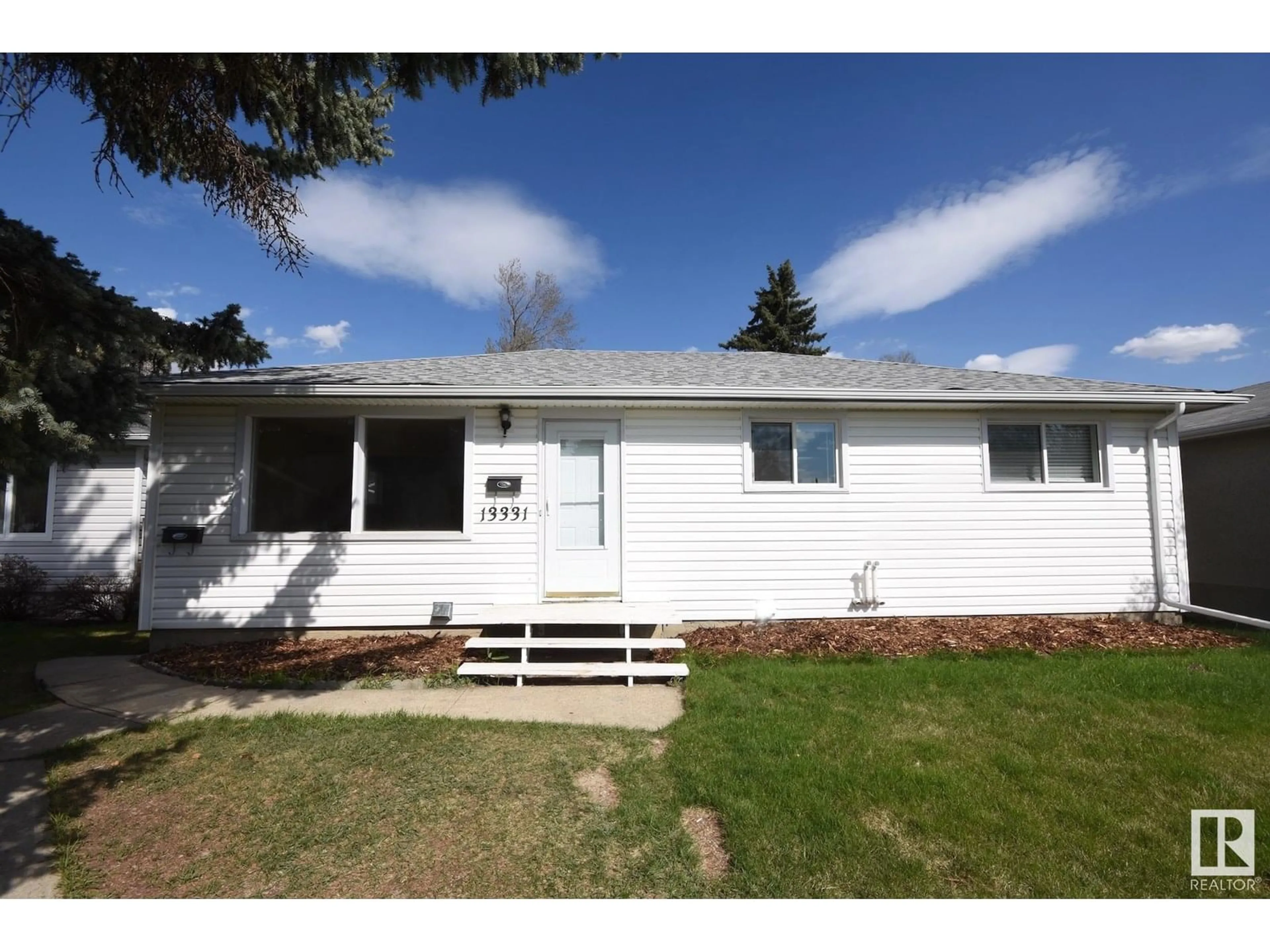 Home with vinyl exterior material, street for 13331 131 ST, Edmonton Alberta T5L1N8