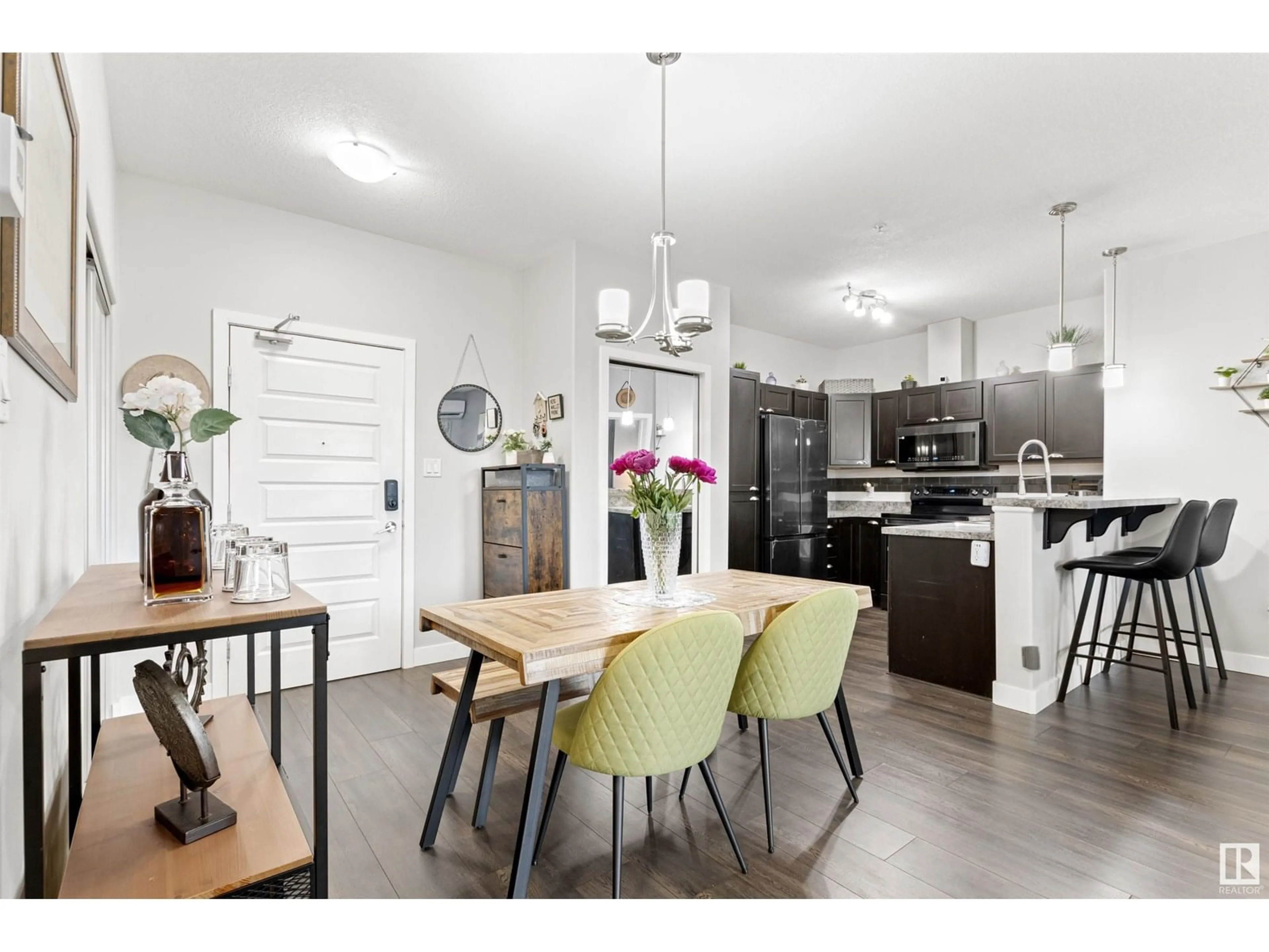 Open concept kitchen, wood/laminate floor for 304 - 124 AMBLESIDE LINK LI, Edmonton Alberta T6W0V2
