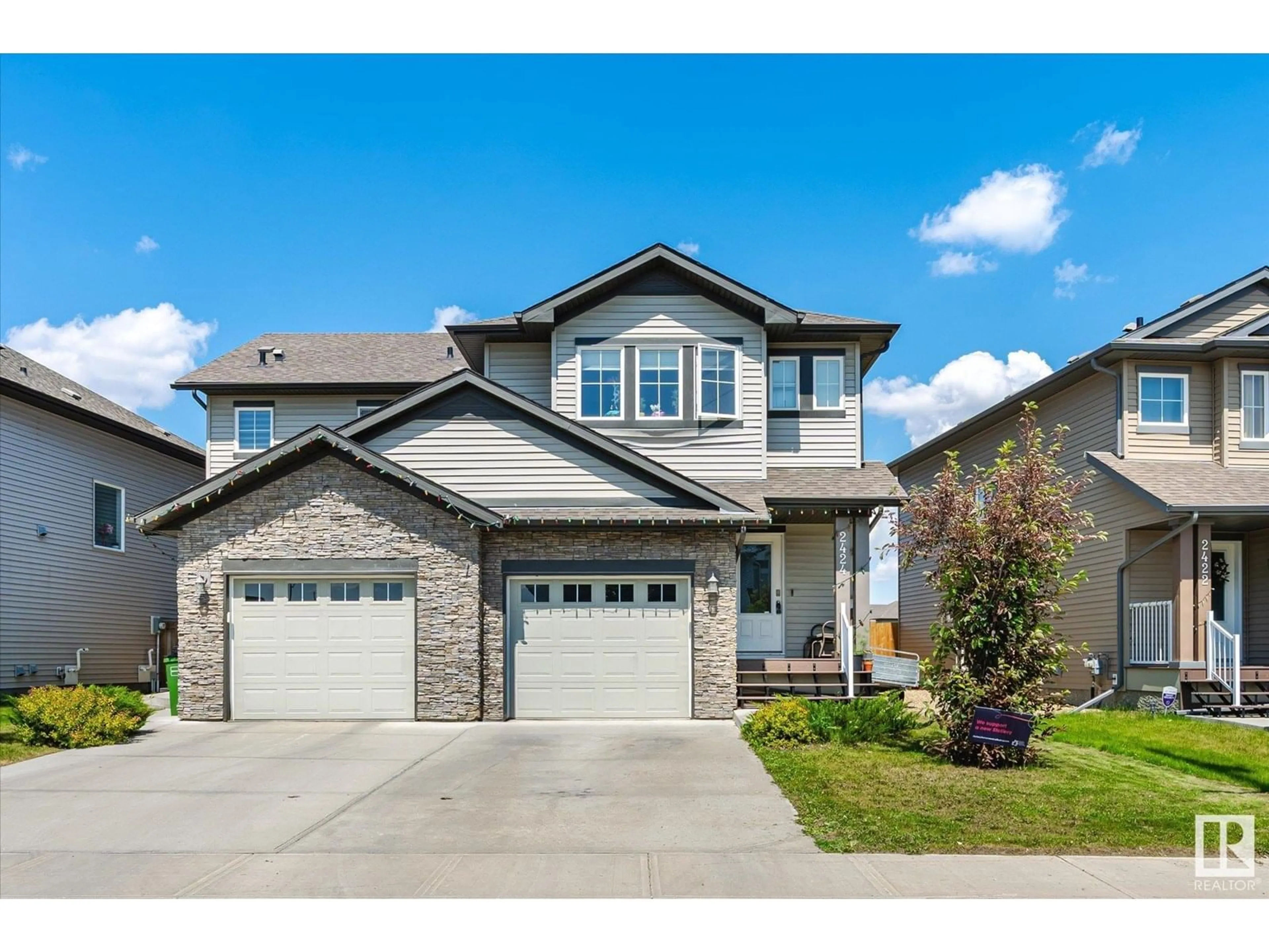 Home with brick exterior material, street for NW - 2424 19A AV, Edmonton Alberta T6T2C9