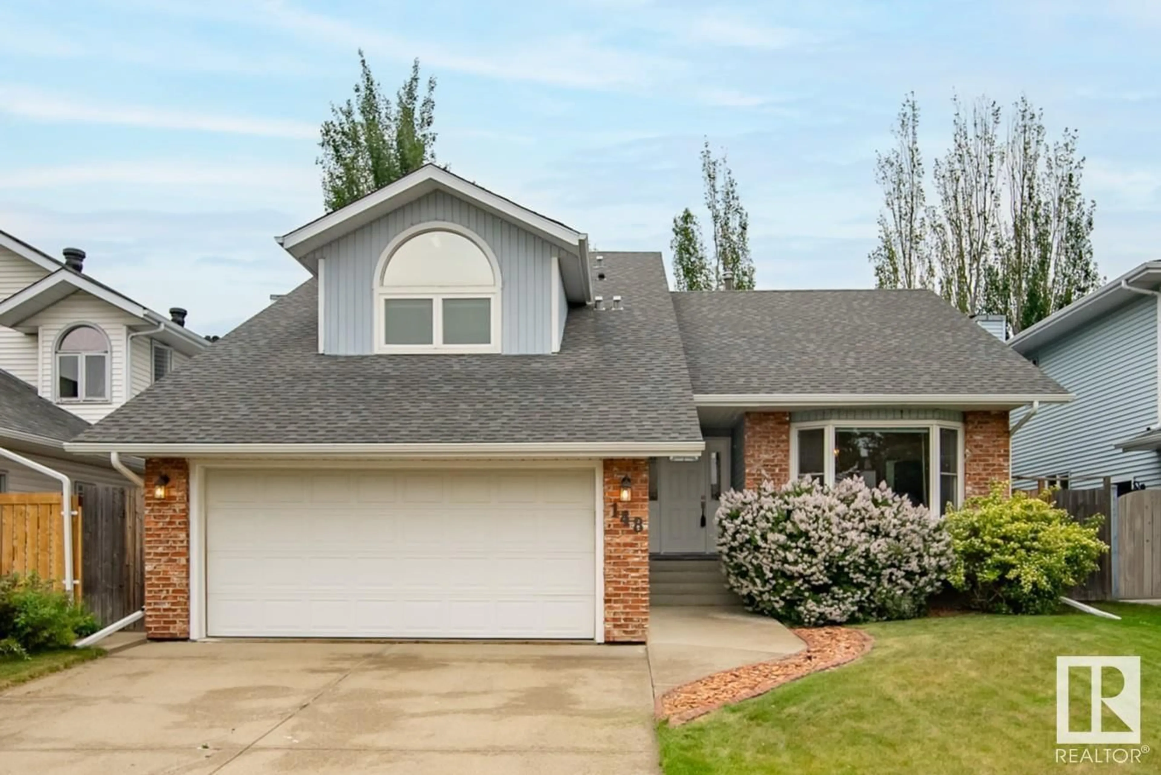 Home with vinyl exterior material, street for 148 WAYGOOD RD, Edmonton Alberta T5T5M1