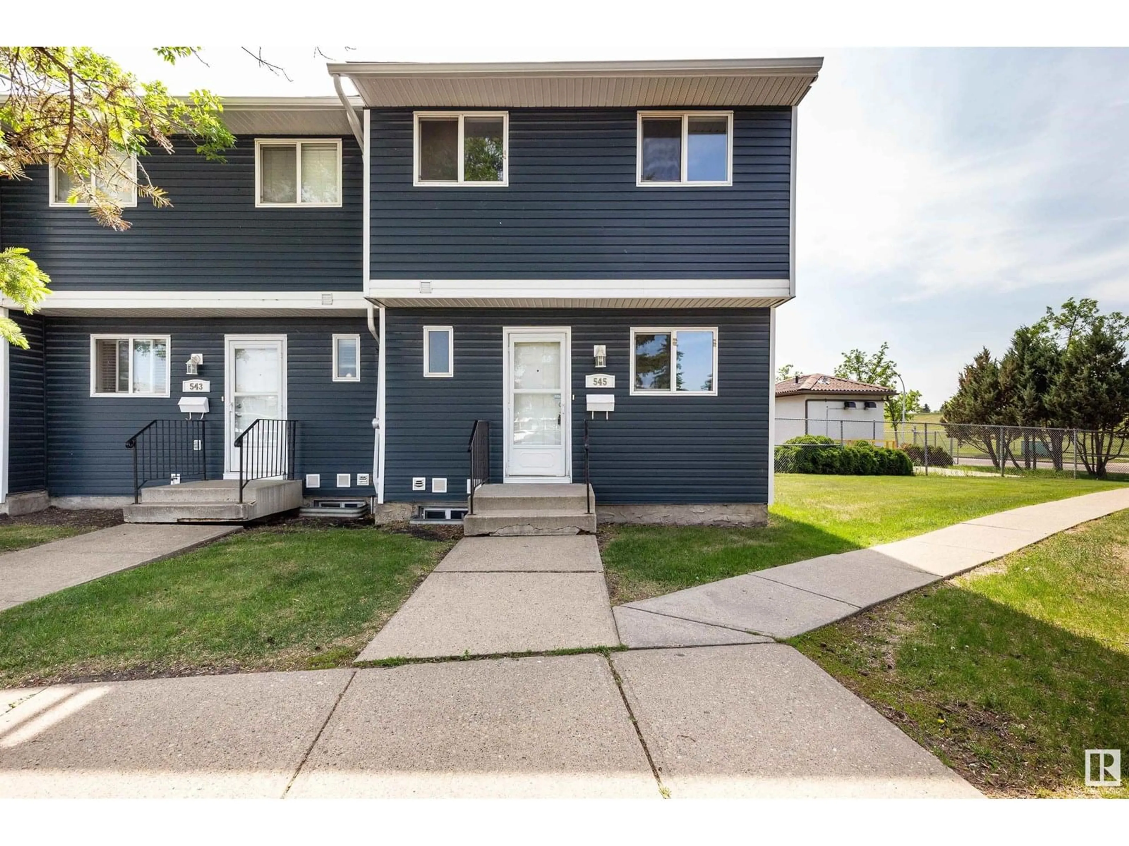 Home with vinyl exterior material, street for 545 DUNLUCE RD, Edmonton Alberta T5X4P4