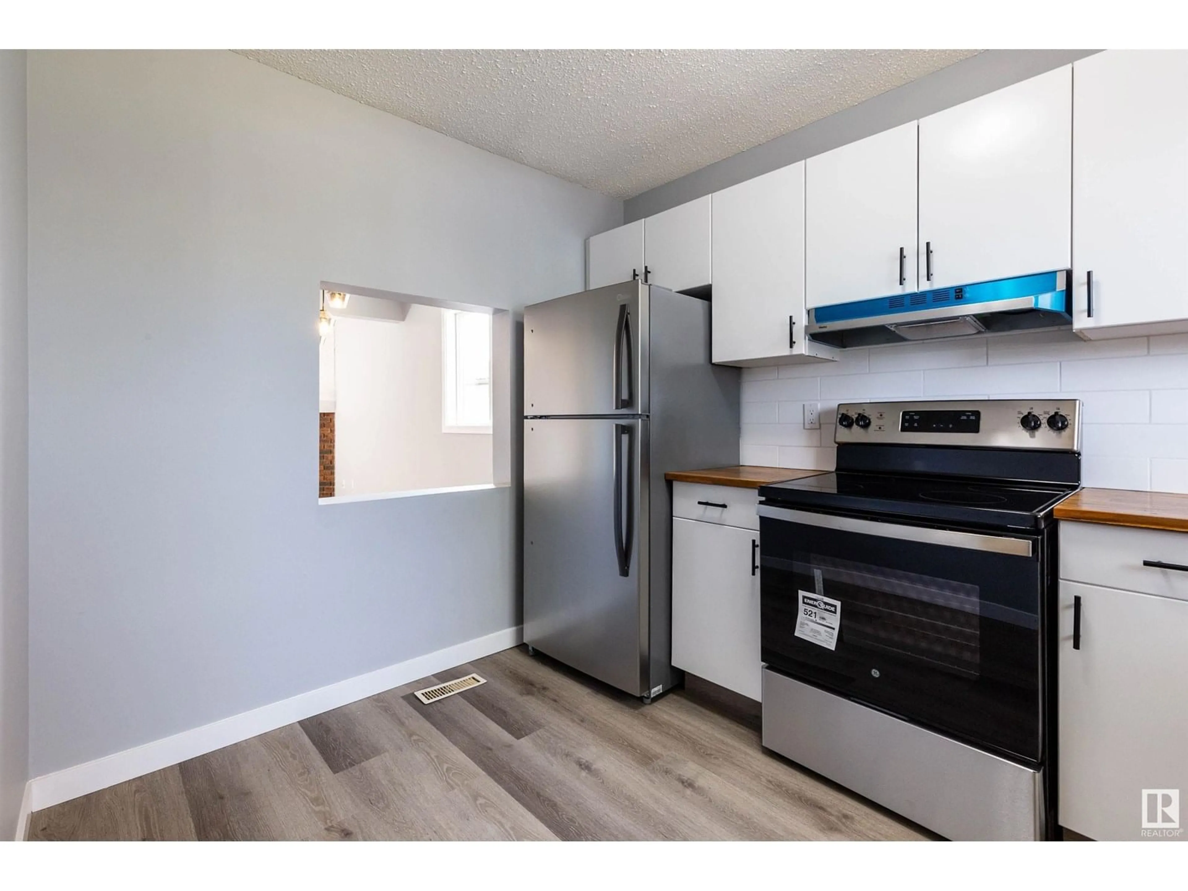 Standard kitchen, wood/laminate floor for 545 DUNLUCE RD, Edmonton Alberta T5X4P4