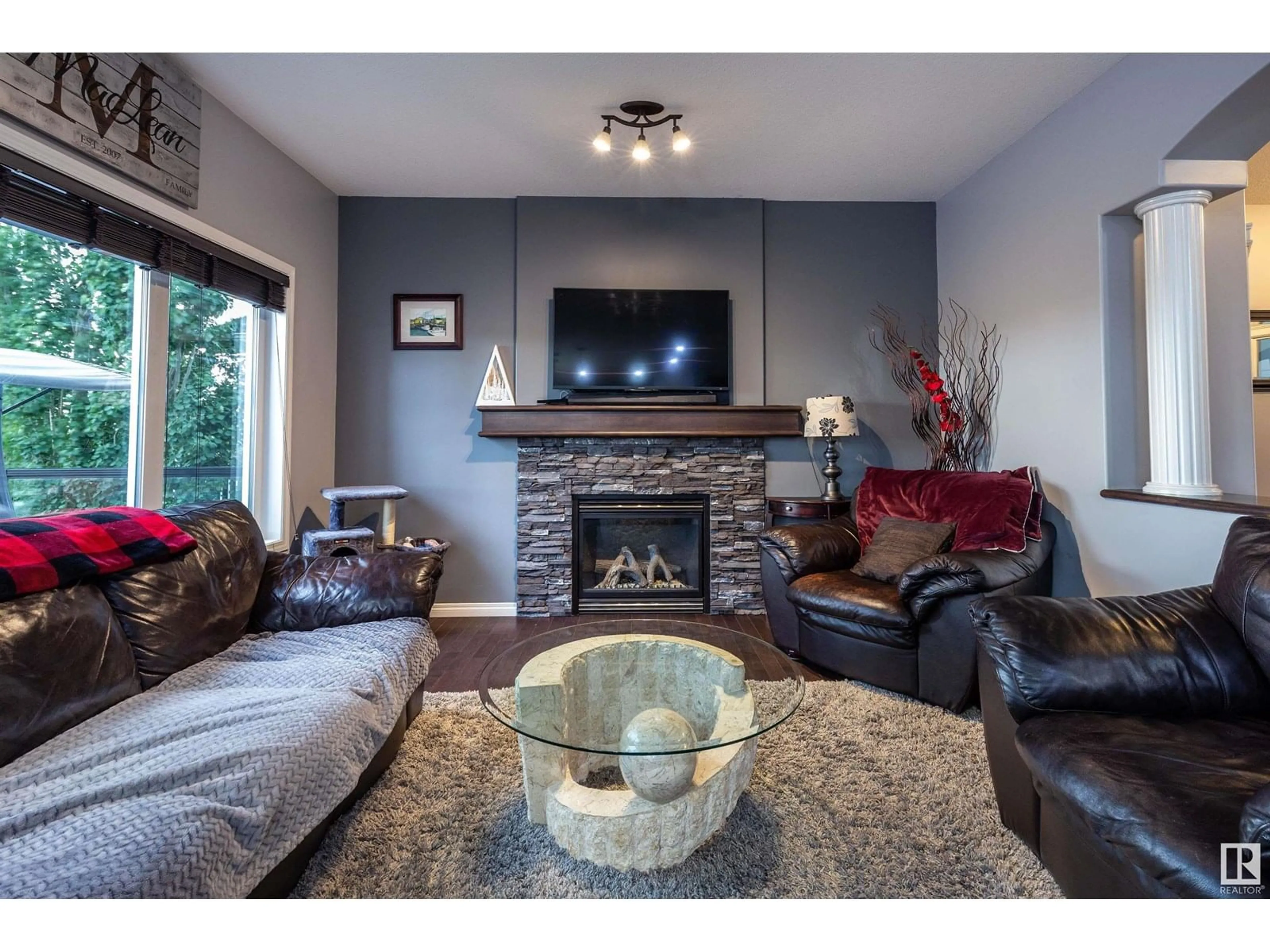 Living room with furniture, wood/laminate floor for 54 RUE BLANCHARD, Beaumont Alberta T4X0E7