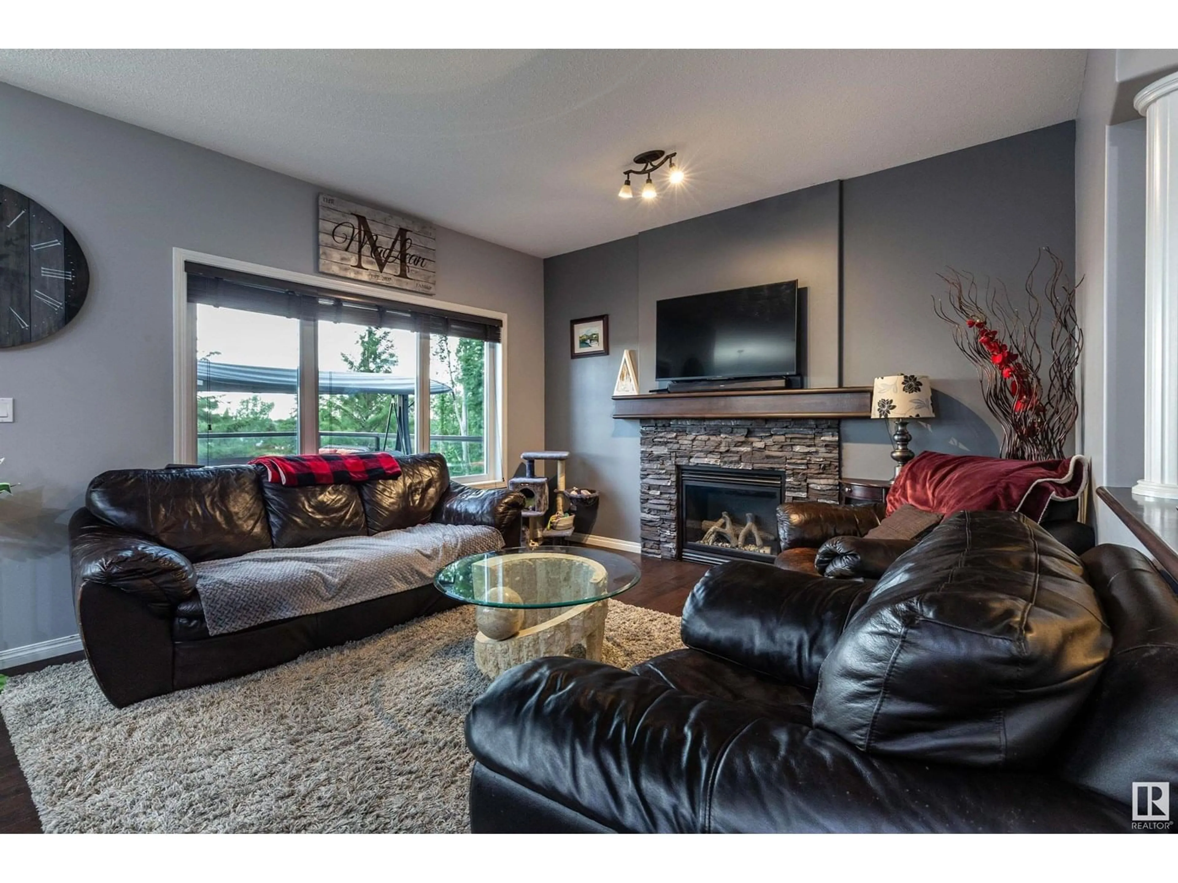 Living room with furniture, wood/laminate floor for 54 RUE BLANCHARD, Beaumont Alberta T4X0E7