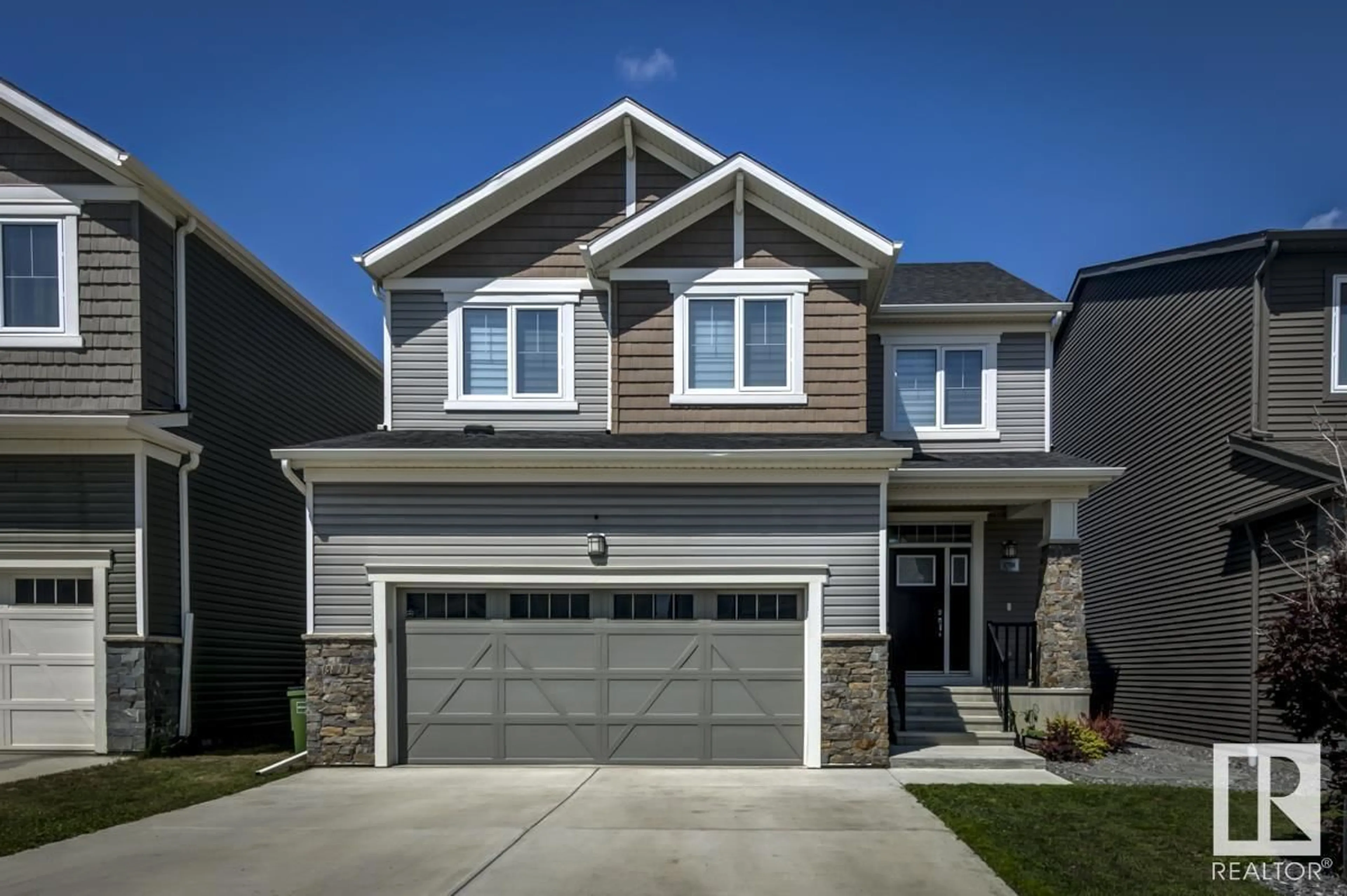 Home with vinyl exterior material, street for NW - 1708 201 ST, Edmonton Alberta T6M0Y1