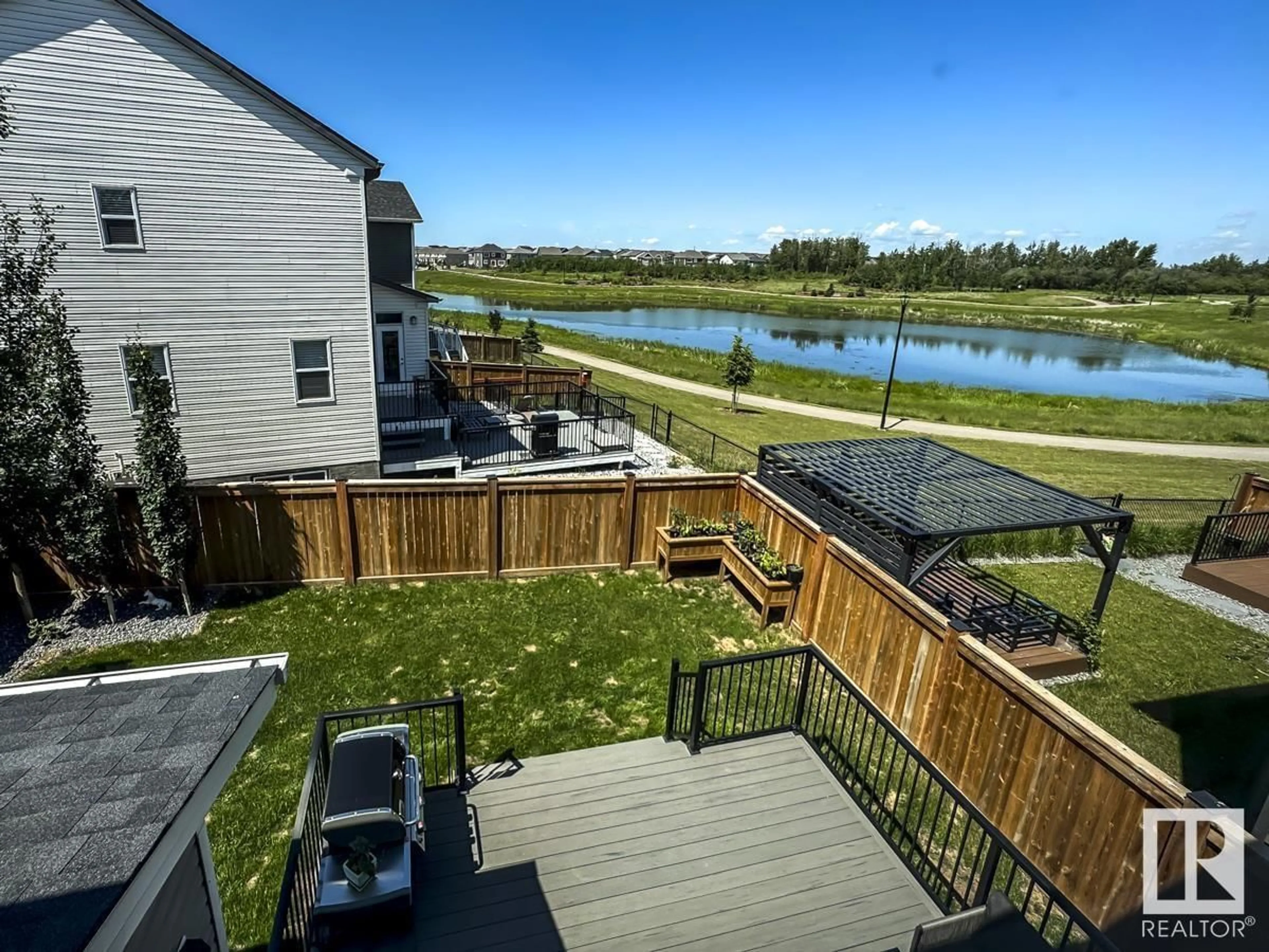 A pic from outside/outdoor area/front of a property/back of a property/a pic from drone, water/lake/river/ocean view for NW - 1708 201 ST, Edmonton Alberta T6M0Y1