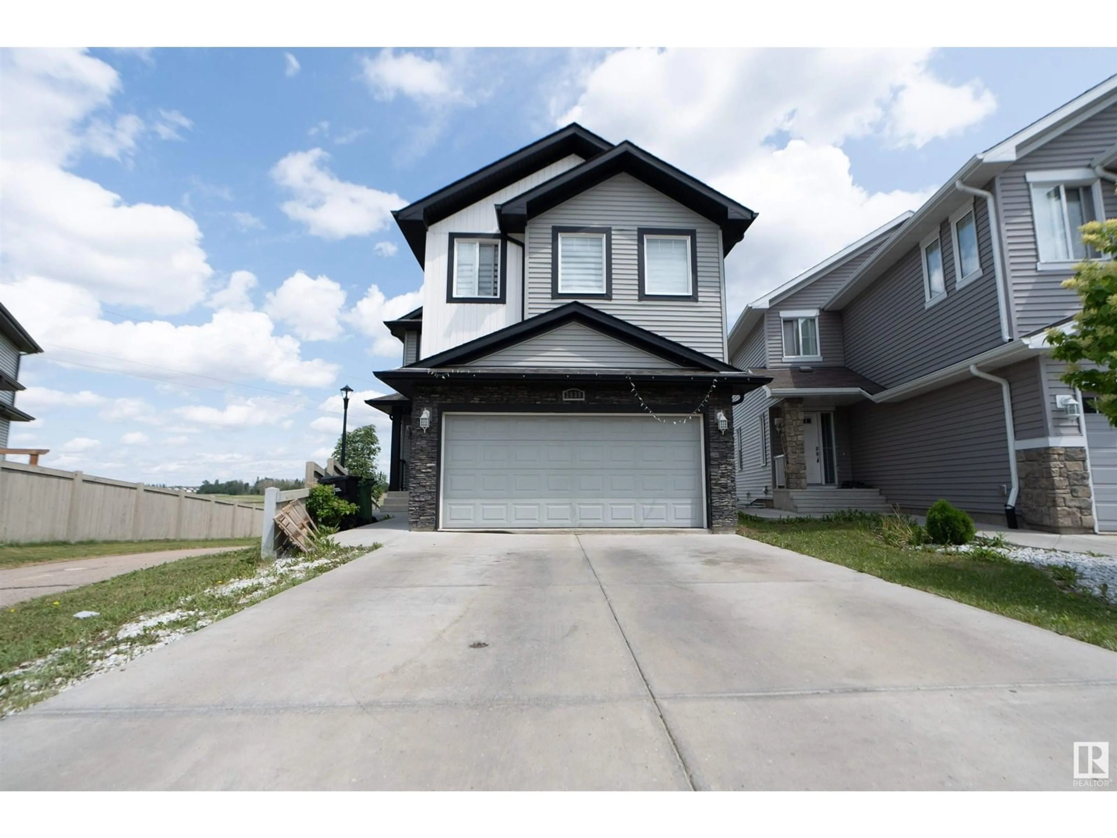 Home with vinyl exterior material, street for 2939 11 ST, Edmonton Alberta T6T0X7