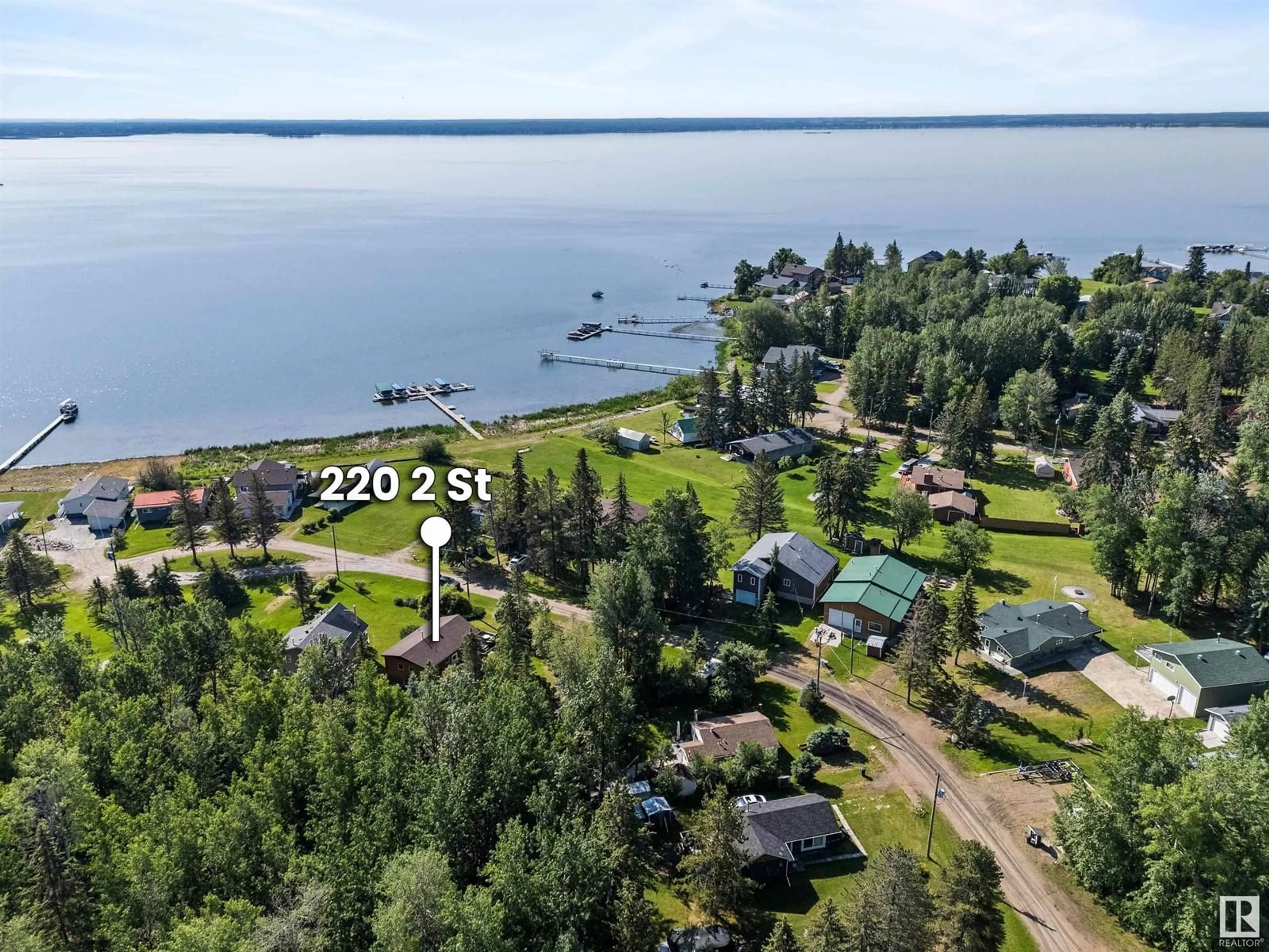 A pic from outside/outdoor area/front of a property/back of a property/a pic from drone, water/lake/river/ocean view for 220 2 ST, Rural Lac Ste. Anne County Alberta T0E1A0