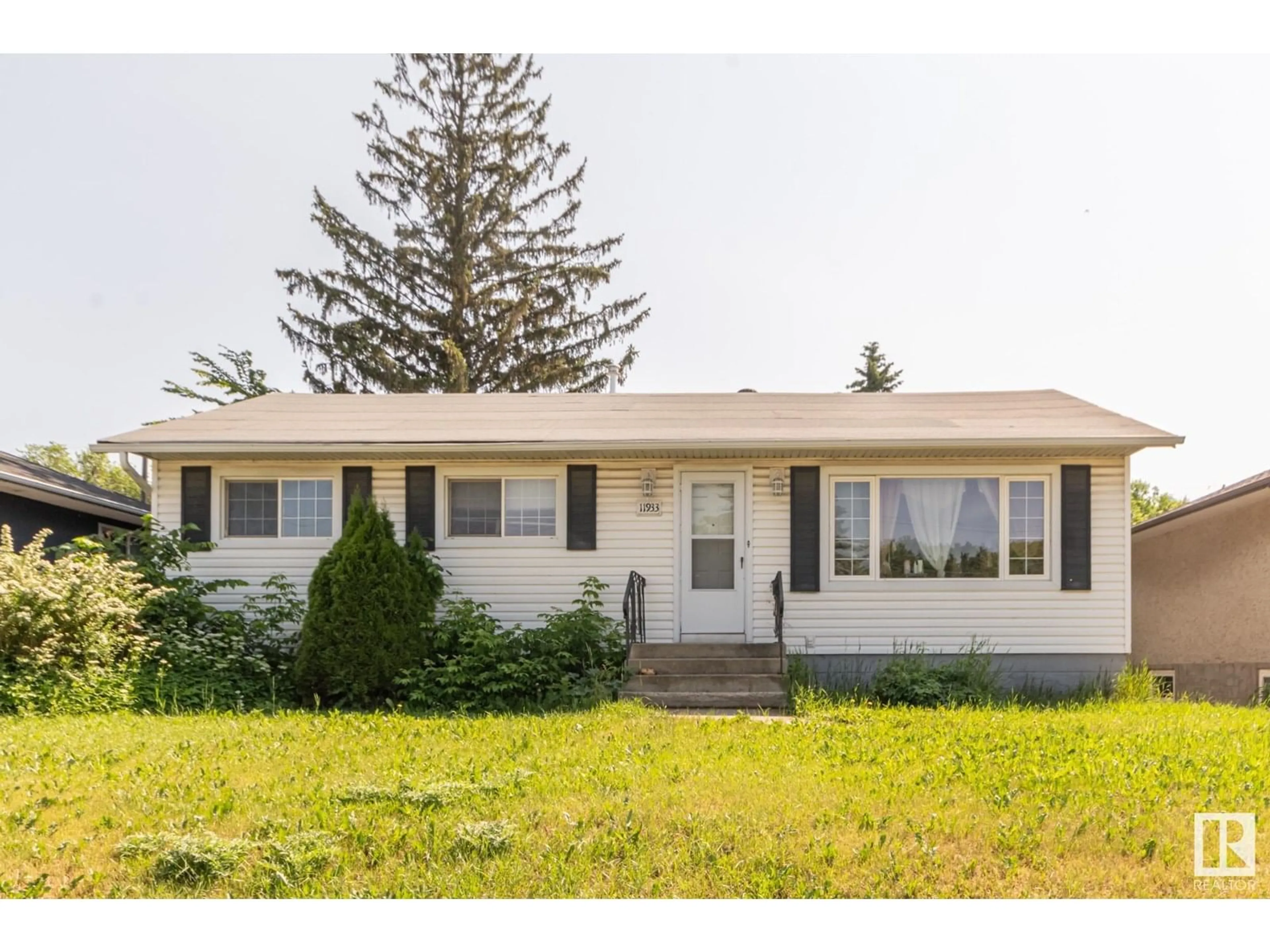 Home with vinyl exterior material, street for NW - 11933 50 ST, Edmonton Alberta T5W3C1