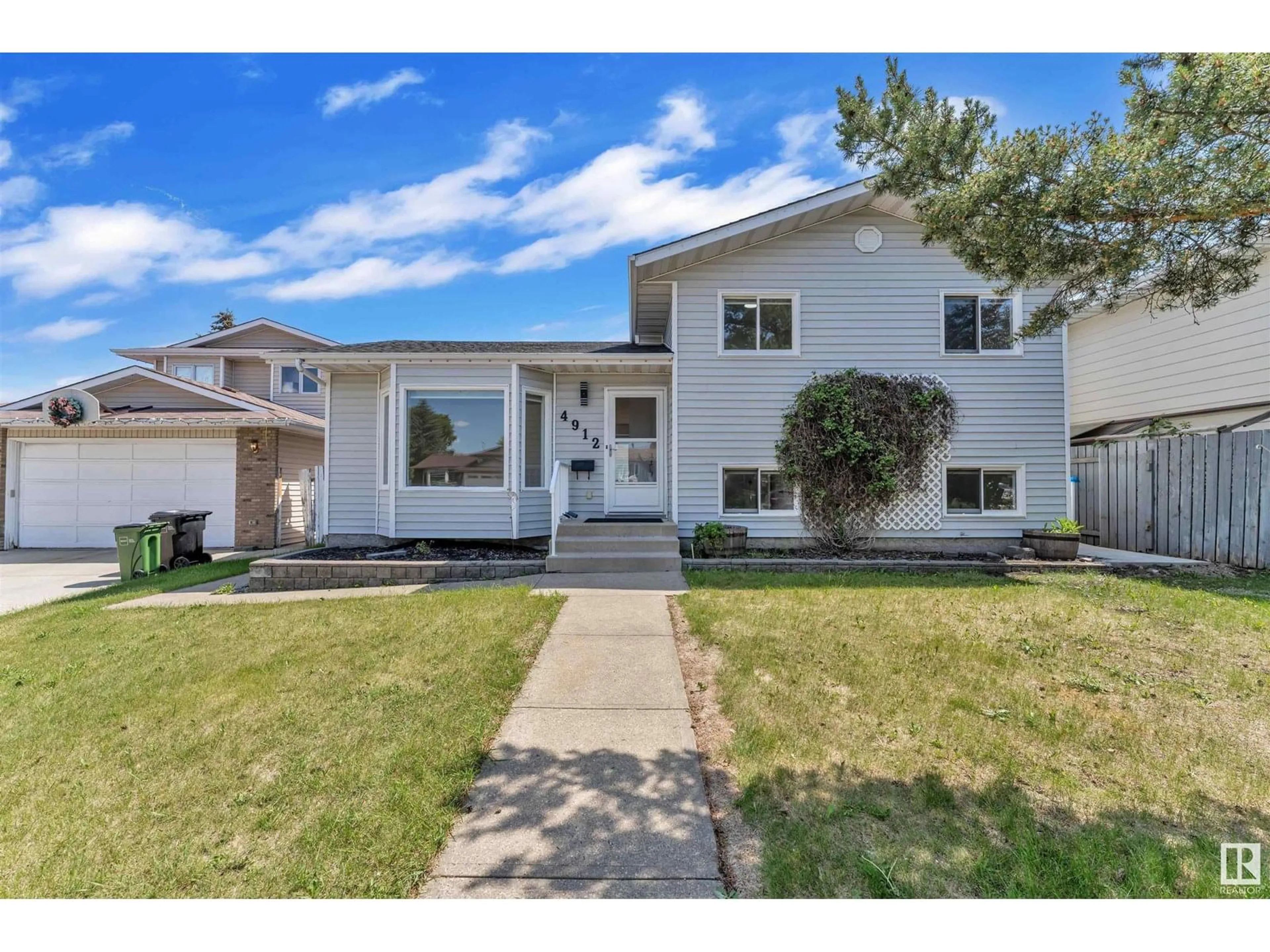 Home with vinyl exterior material, street for 4912 31 AV, Edmonton Alberta T6L5H6