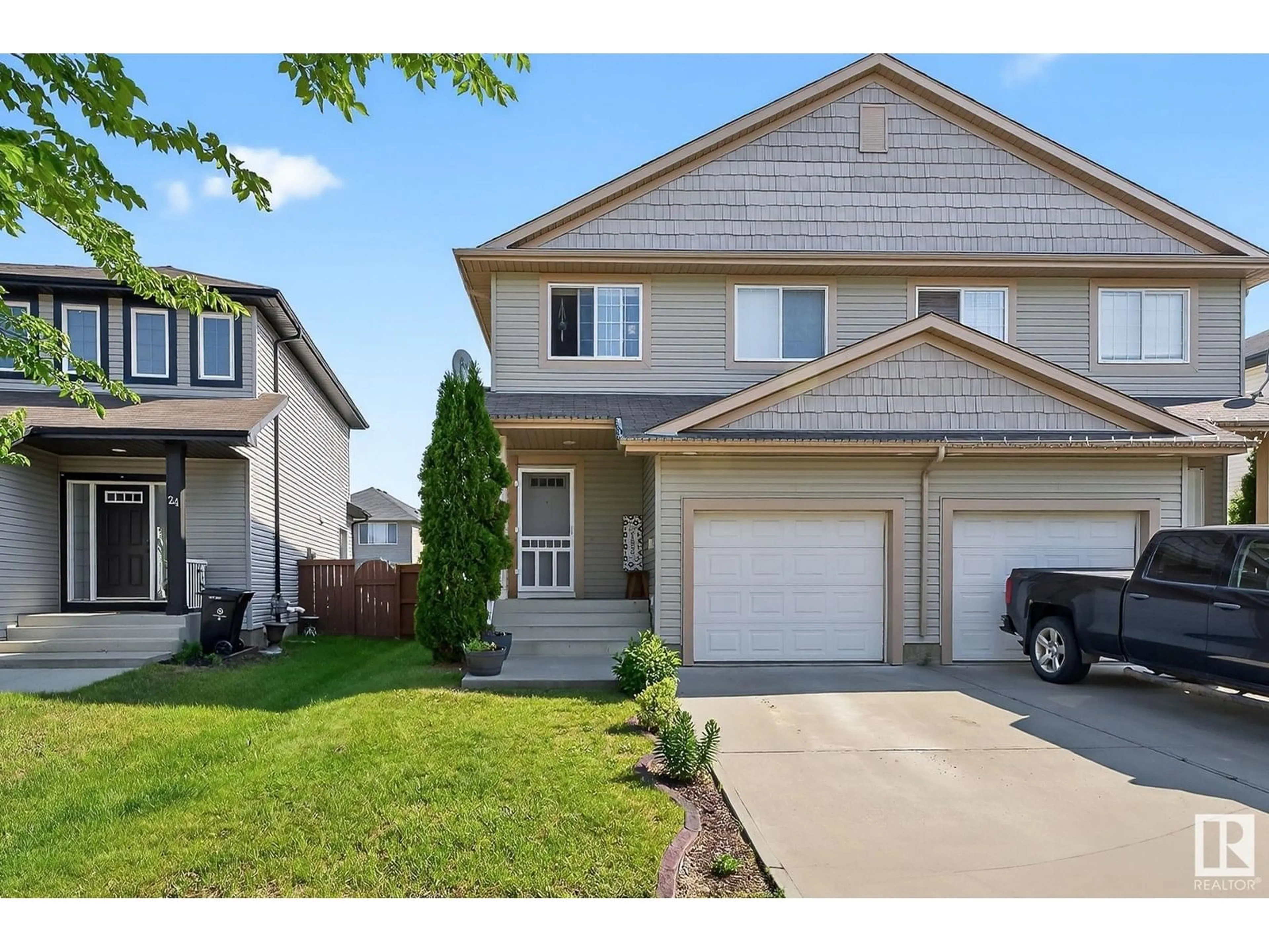 Home with vinyl exterior material, street for 26 CARAGANA WY, Fort Saskatchewan Alberta T8L0B7