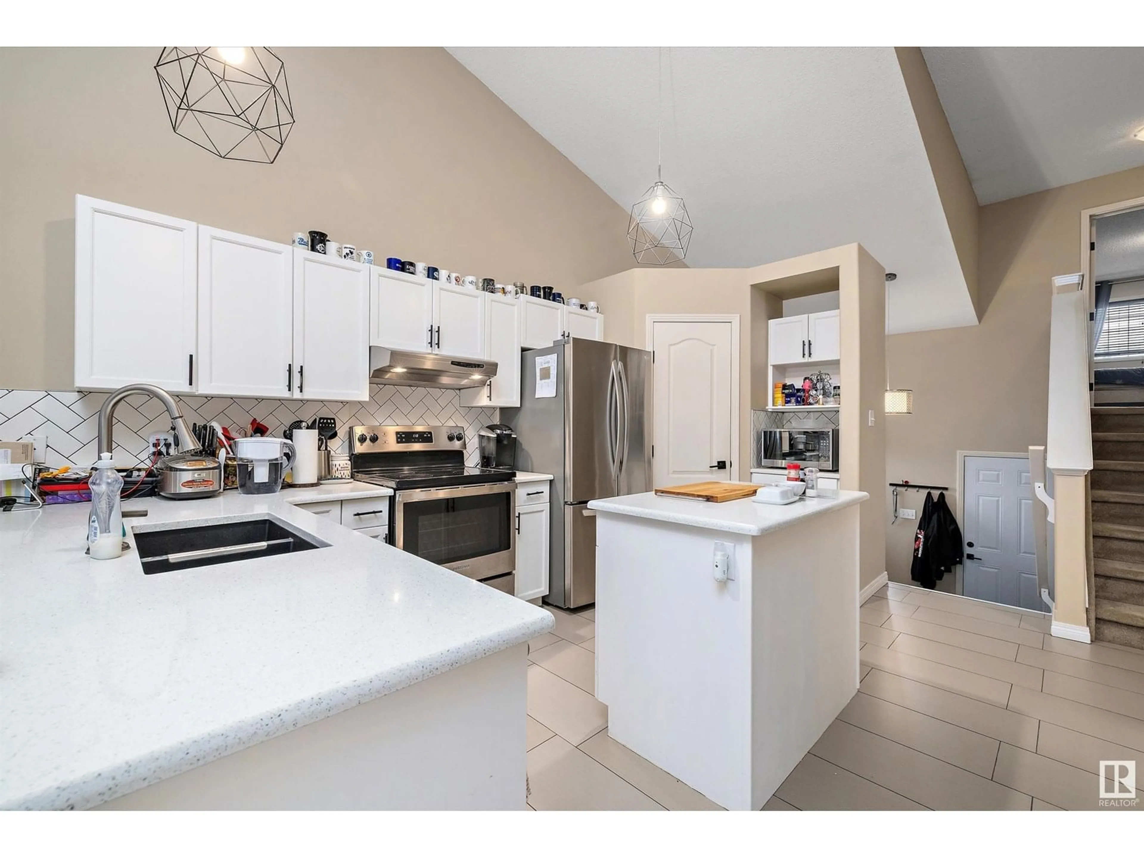 Open concept kitchen, ceramic/tile floor for 4417 151A AV, Edmonton Alberta T5Y3B1