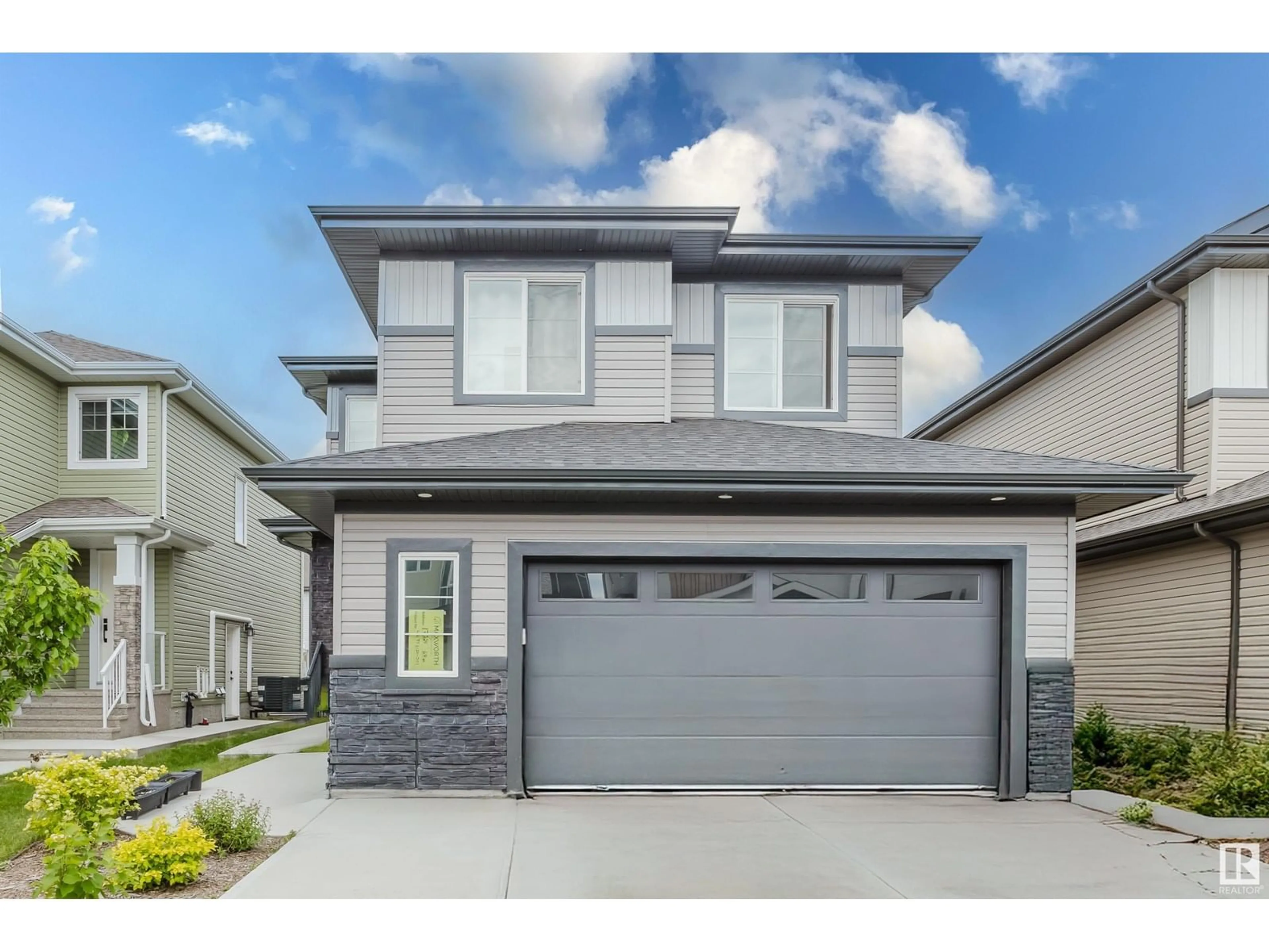 Home with vinyl exterior material, street for 17328 68 ST, Edmonton Alberta T5Z0W4