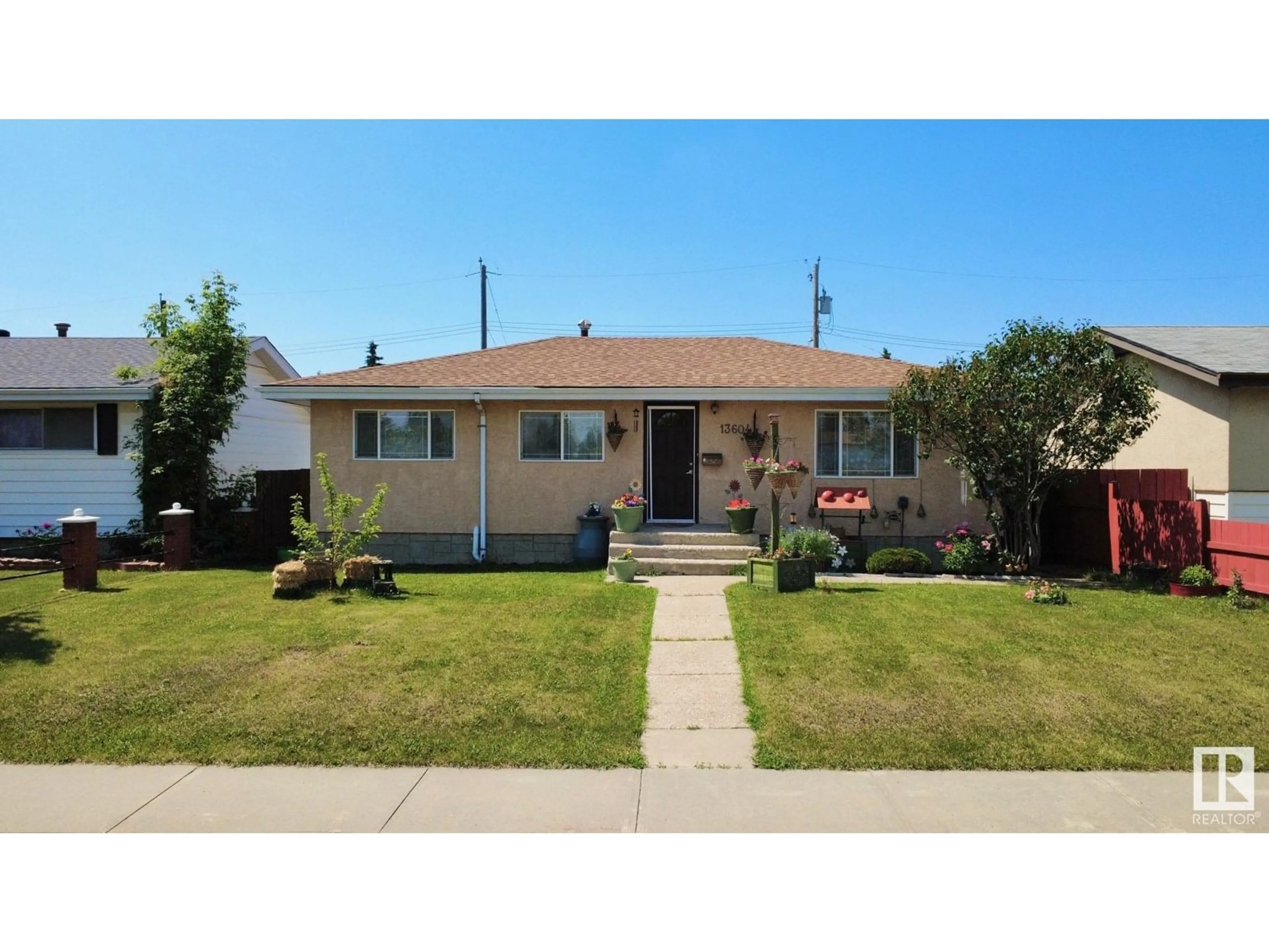 Home with vinyl exterior material, street for 13604 113A ST NW, Edmonton Alberta T5E5C4