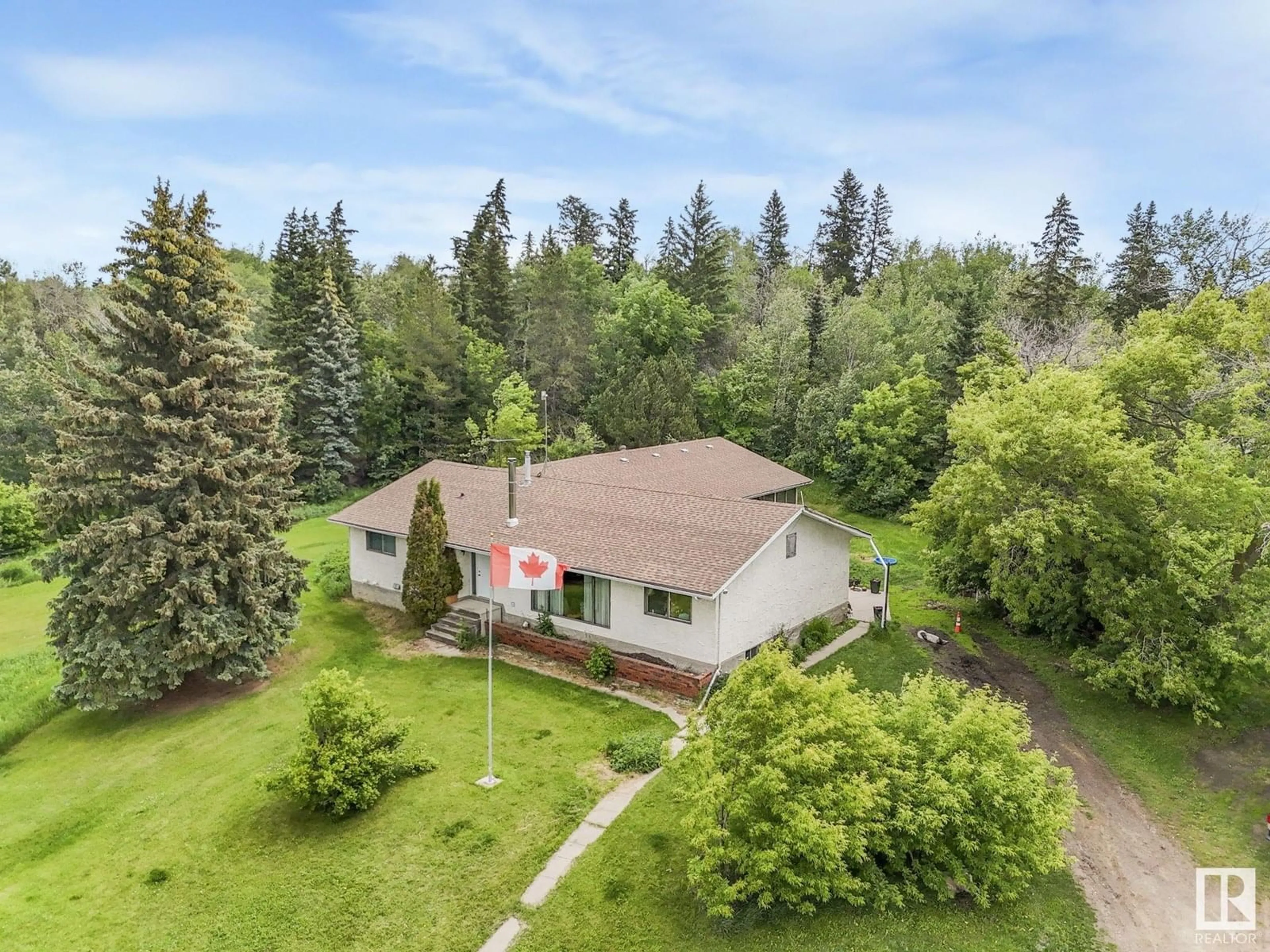 A pic from outside/outdoor area/front of a property/back of a property/a pic from drone, unknown for 51531 HIGHWAY 770, Rural Parkland County Alberta T7X1X5