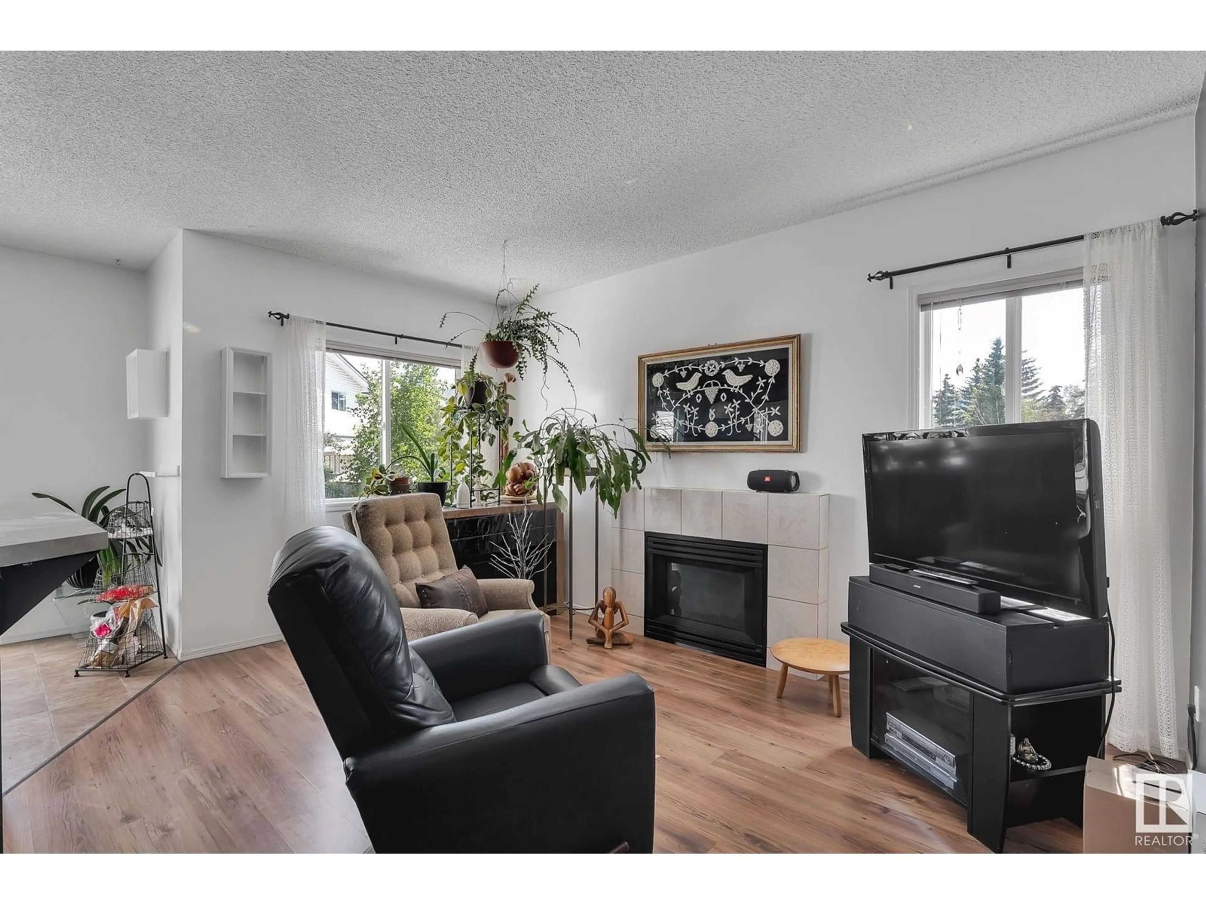 Living room with furniture, wood/laminate floor for #7 - 843 YOUVILLE DR, Edmonton Alberta T6L6X8