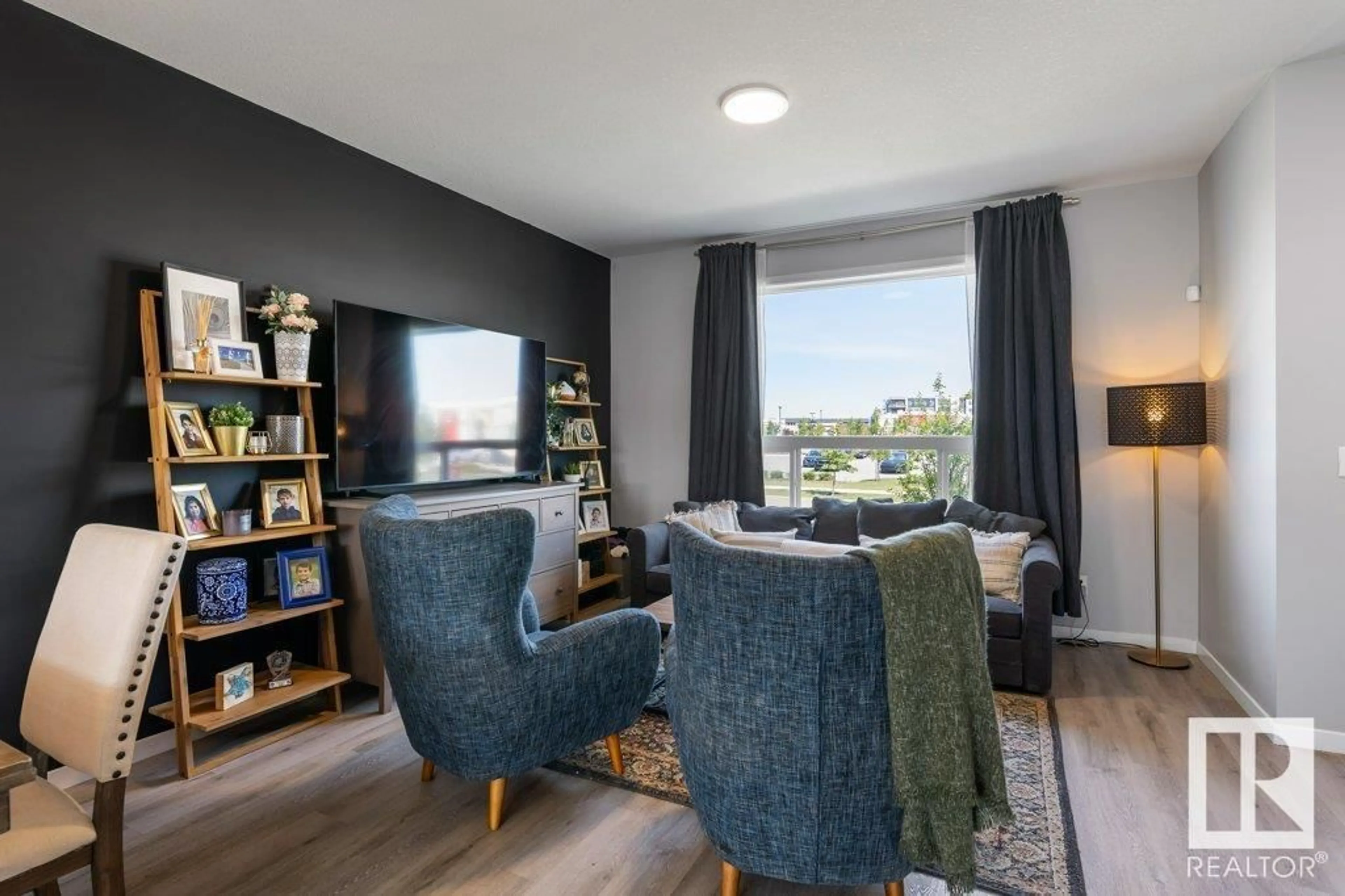 Living room with furniture, wood/laminate floor for 213 RANKIN DR, St. Albert Alberta T8N7Y4