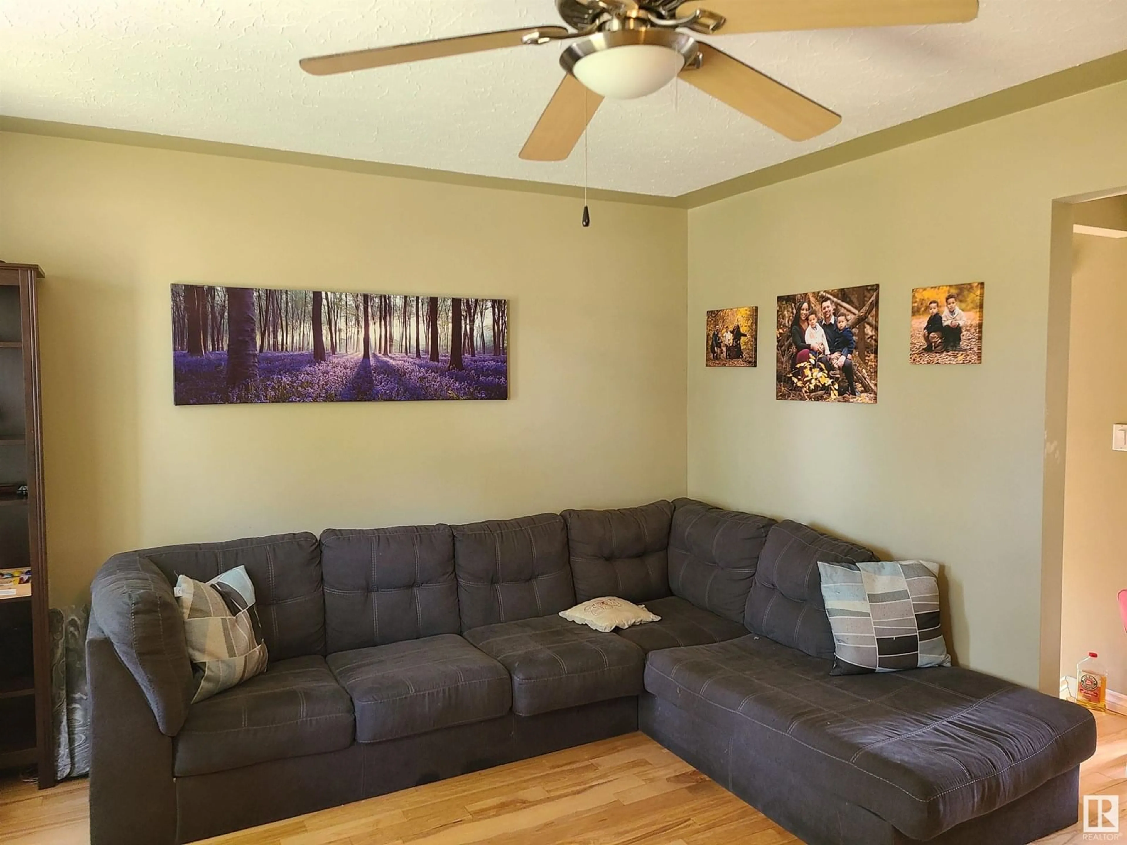 Living room with furniture, wood/laminate floor for 4805 114 AV, Edmonton Alberta T5W0T7