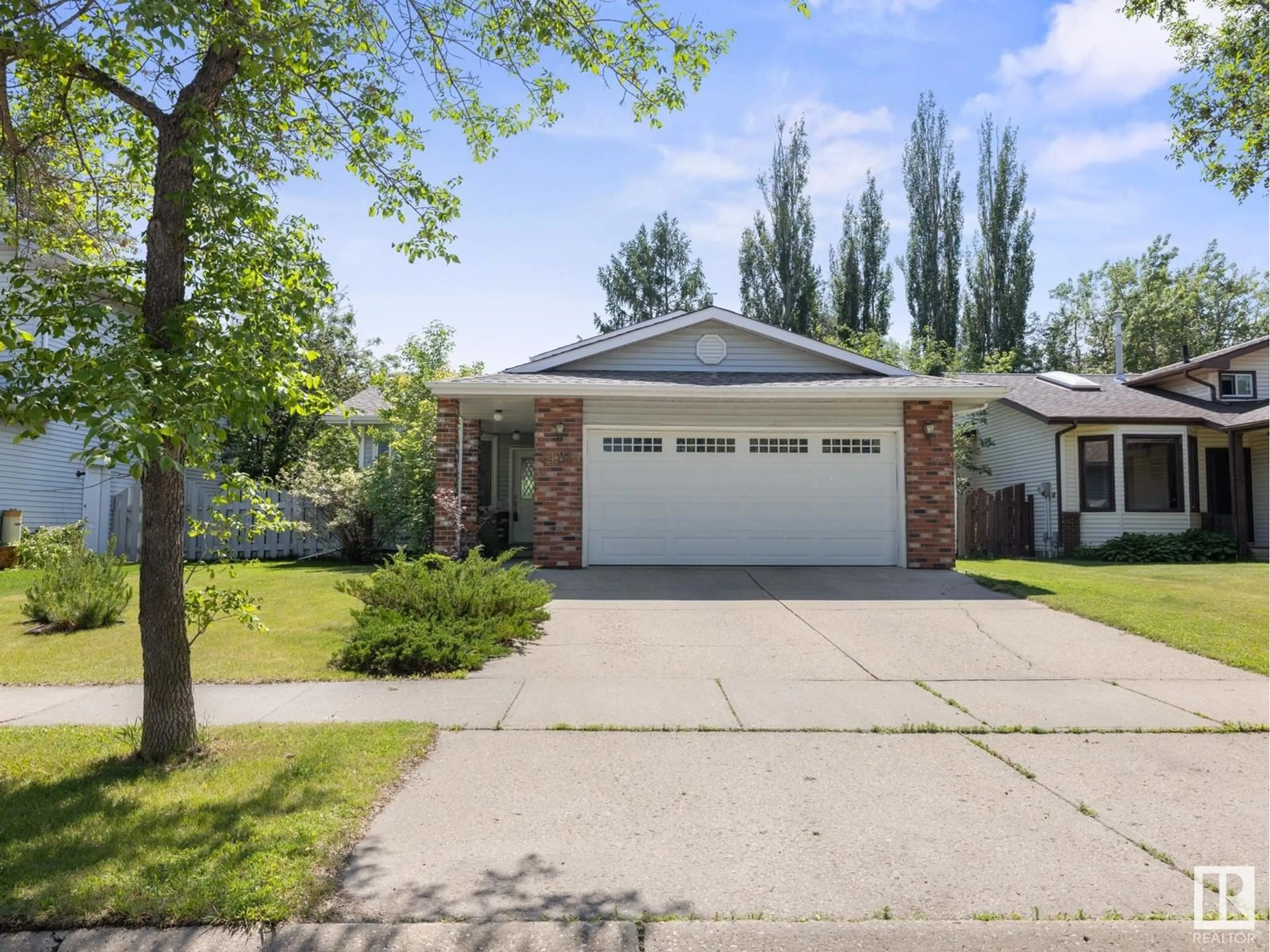Home with vinyl exterior material, street for NW - 14815 39 AV, Edmonton Alberta T6R1J6