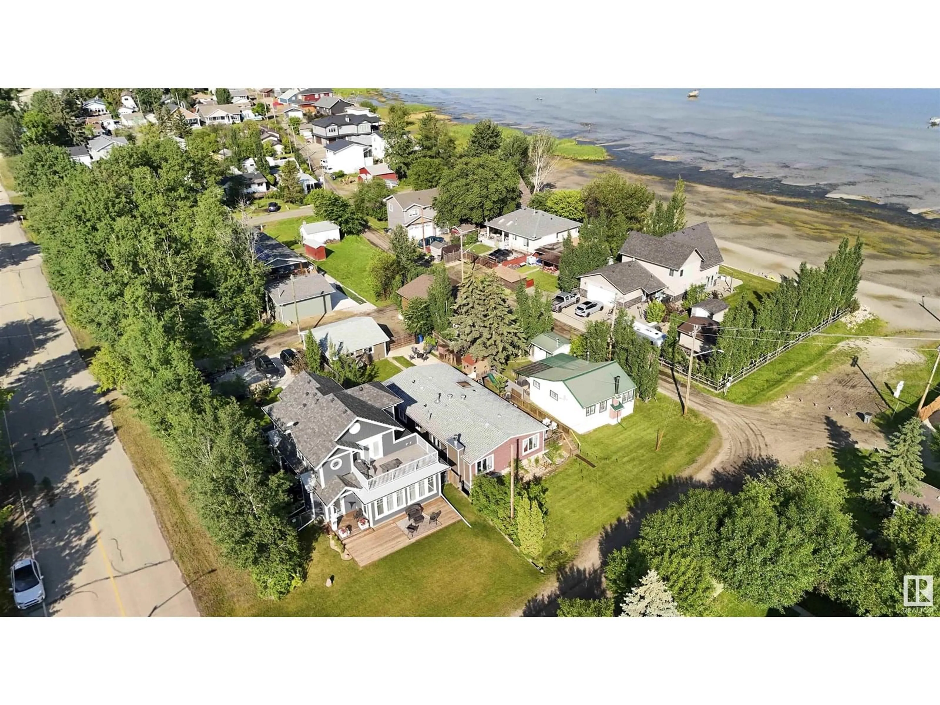 A pic from outside/outdoor area/front of a property/back of a property/a pic from drone, water/lake/river/ocean view for 5008 55 ST, Rural Lac Ste. Anne County Alberta T0E0A0