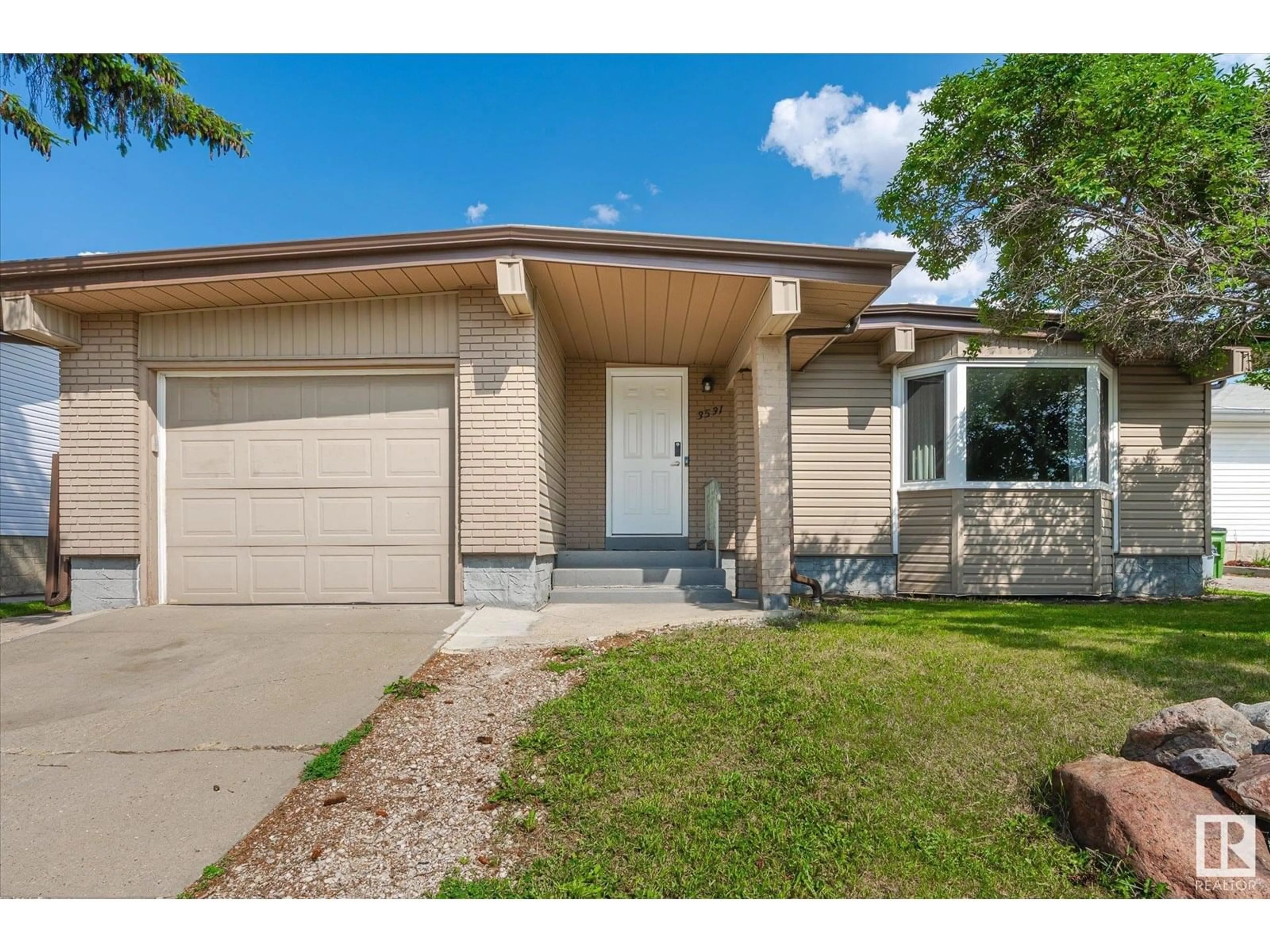 Home with vinyl exterior material, street for NW - 3531 106 ST, Edmonton Alberta T6J2L2