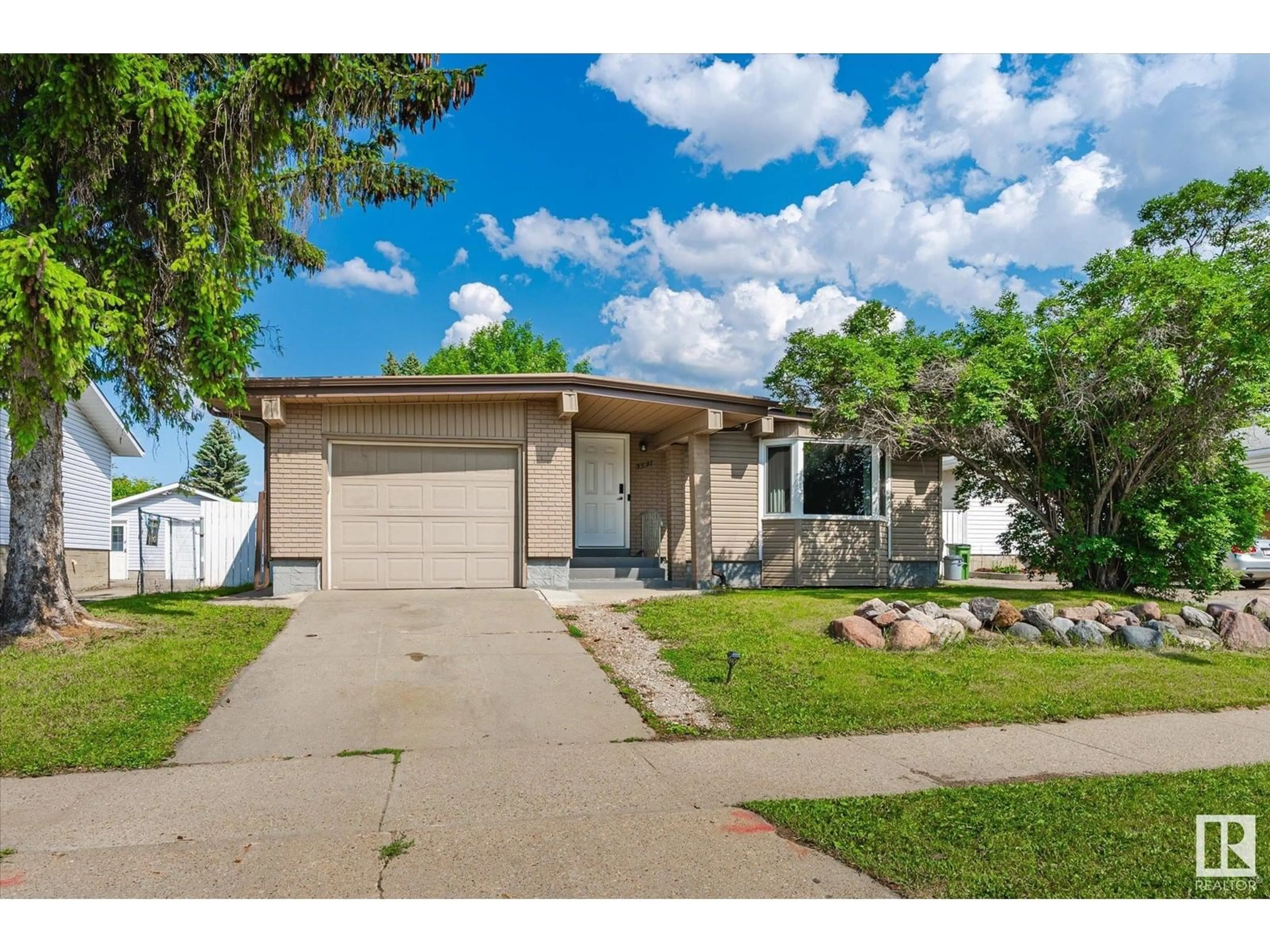 Home with vinyl exterior material, street for NW - 3531 106 ST, Edmonton Alberta T6J2L2