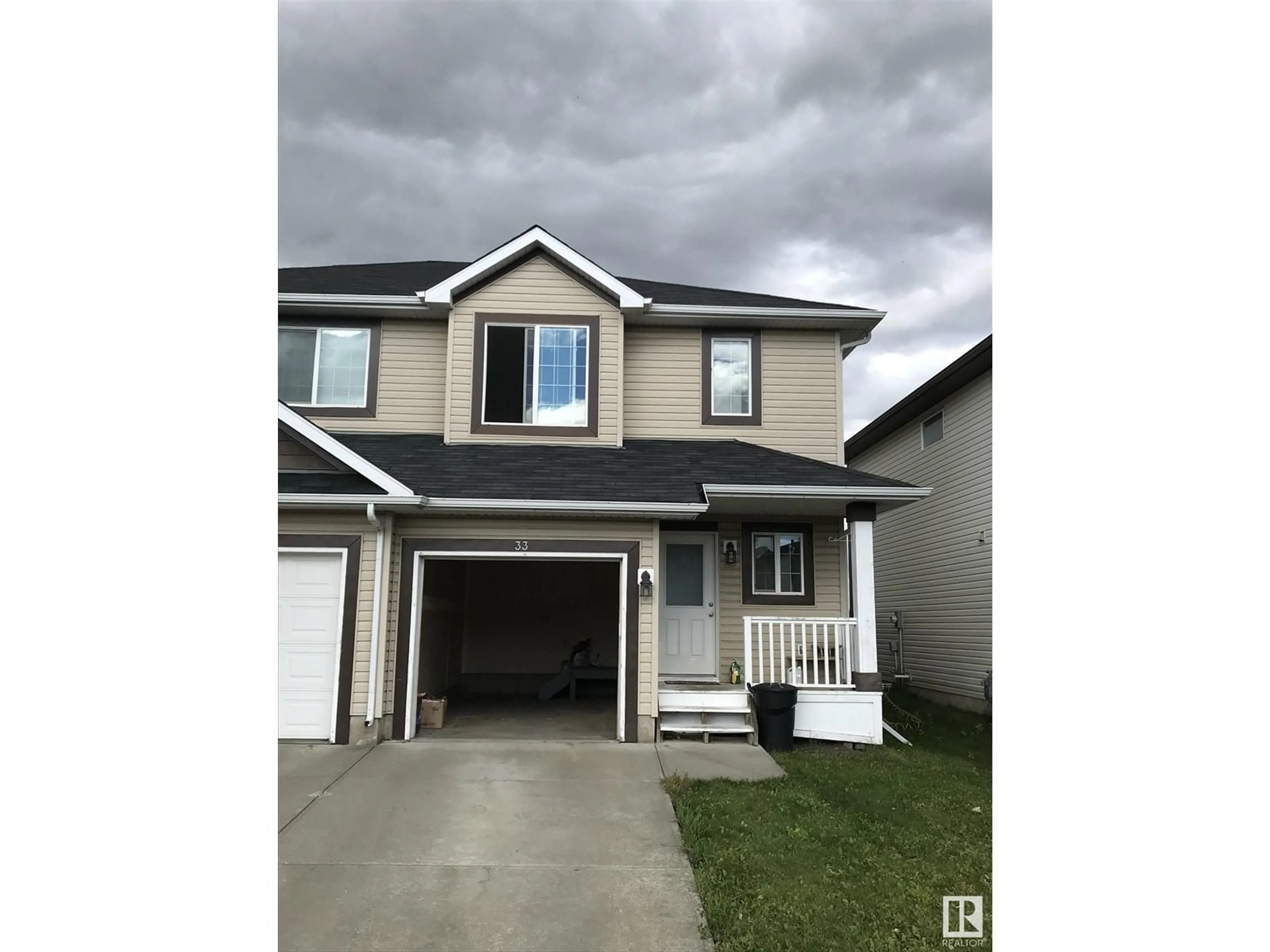 Home with vinyl exterior material, street for 33 RED CANYON WY, Fort Saskatchewan Alberta T8L0E8