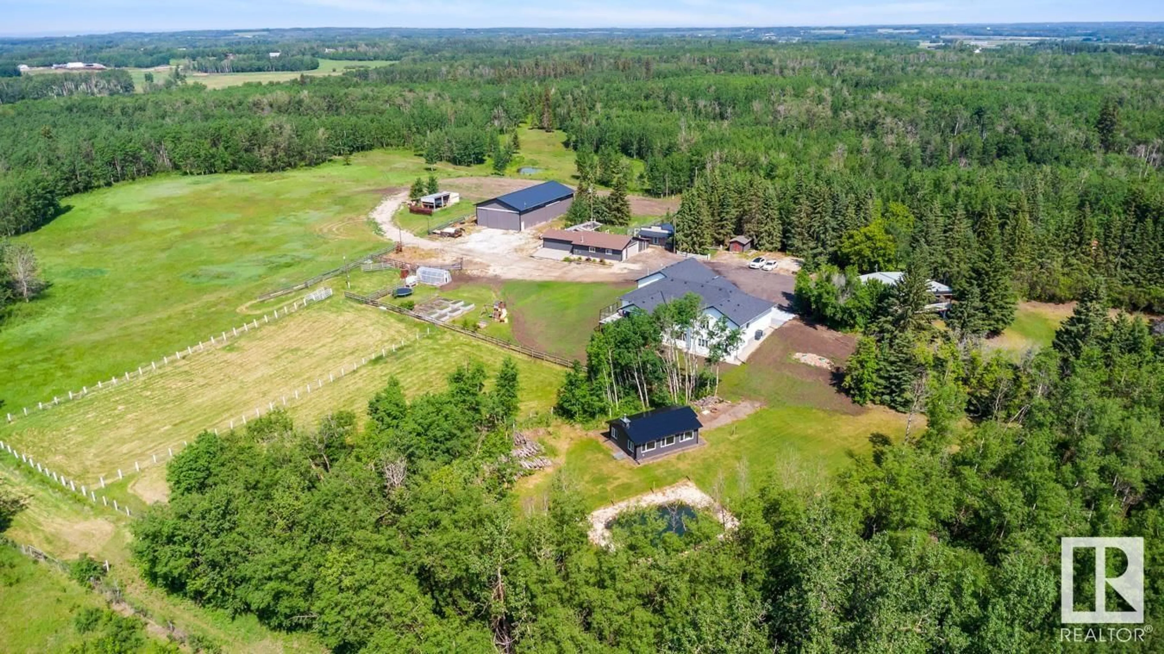 A pic from outside/outdoor area/front of a property/back of a property/a pic from drone, water/lake/river/ocean view for 53040 RGE ROAD 213, Rural Strathcona County Alberta T8G2C4
