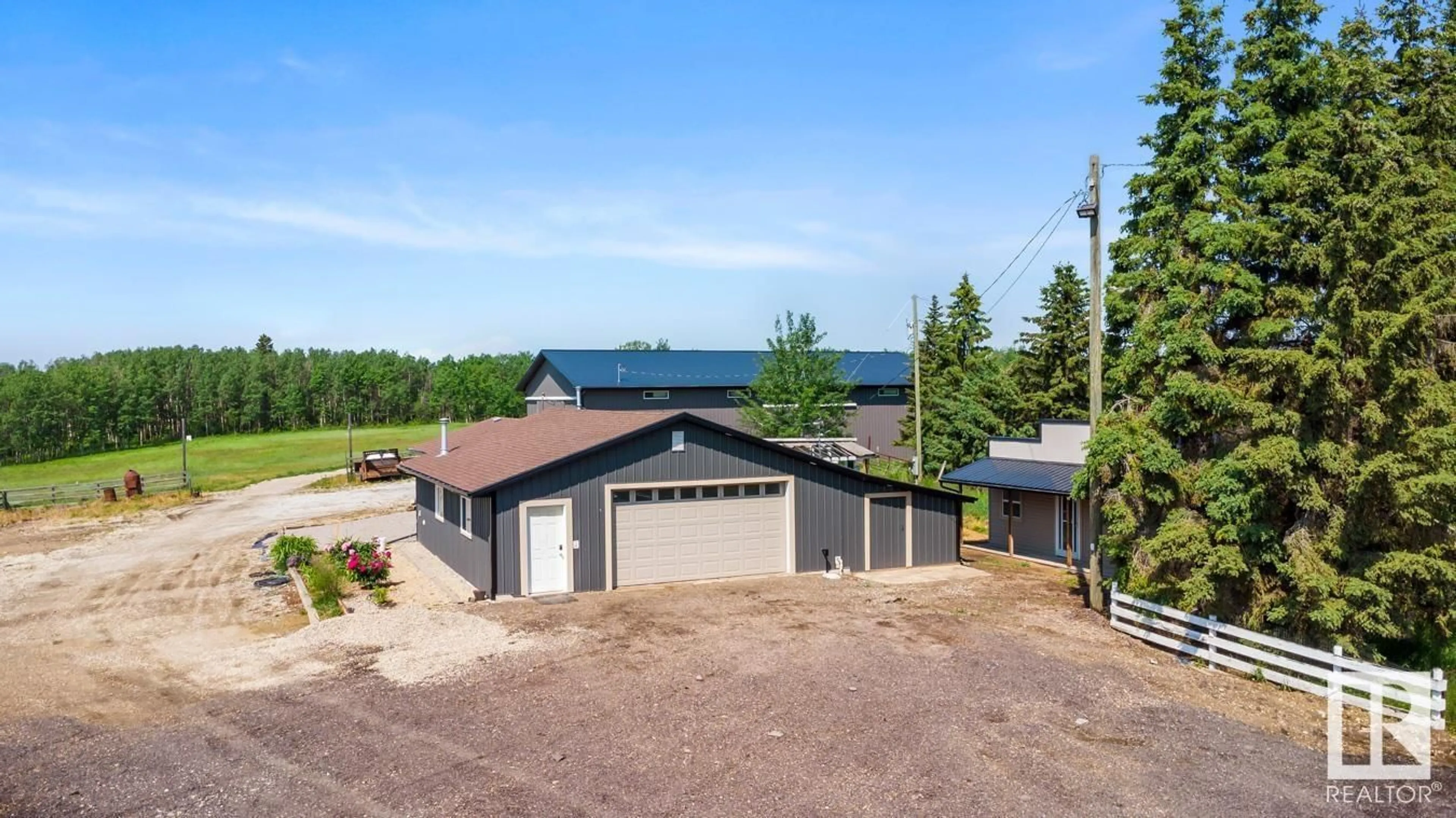 A pic from outside/outdoor area/front of a property/back of a property/a pic from drone, mountain view for 53040 RGE ROAD 213, Rural Strathcona County Alberta T8G2C4