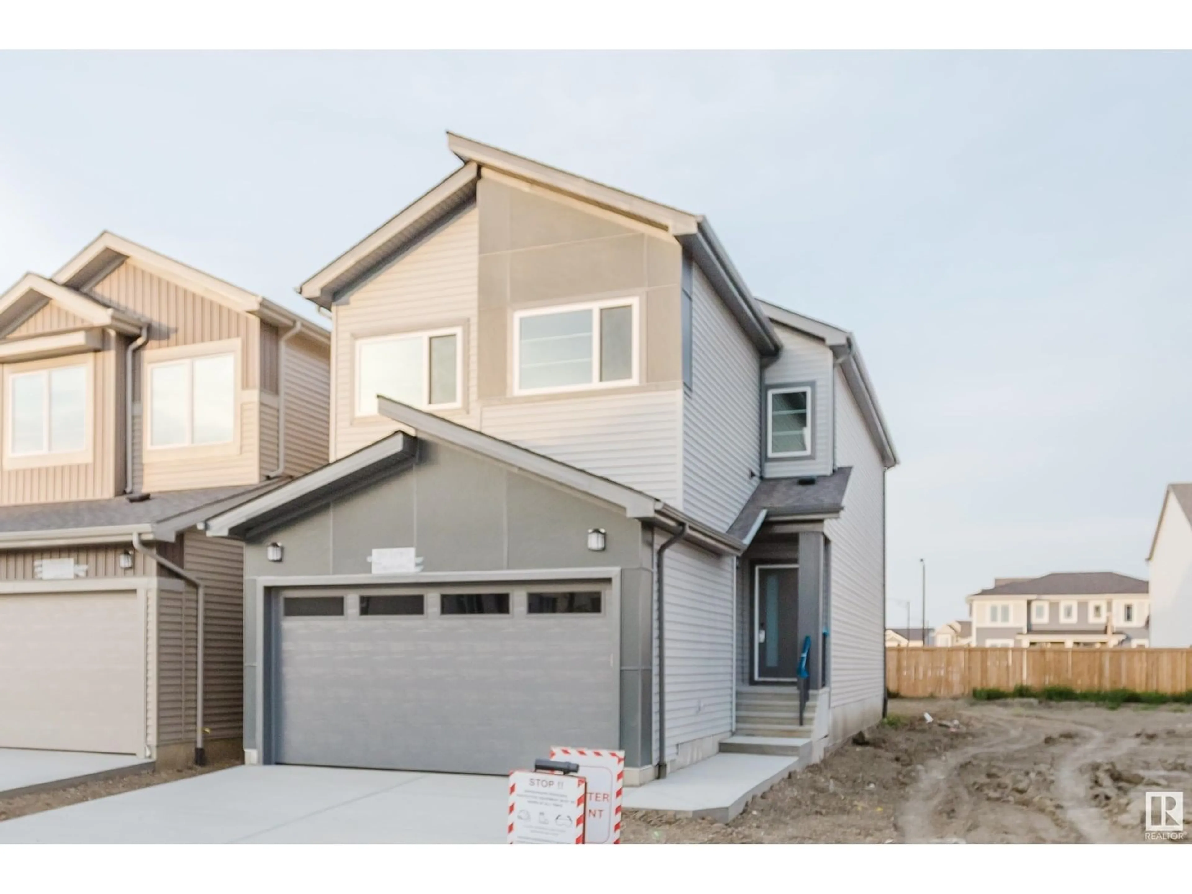 Home with vinyl exterior material, street for NW - 1961 209A ST, Edmonton Alberta T6M3C9