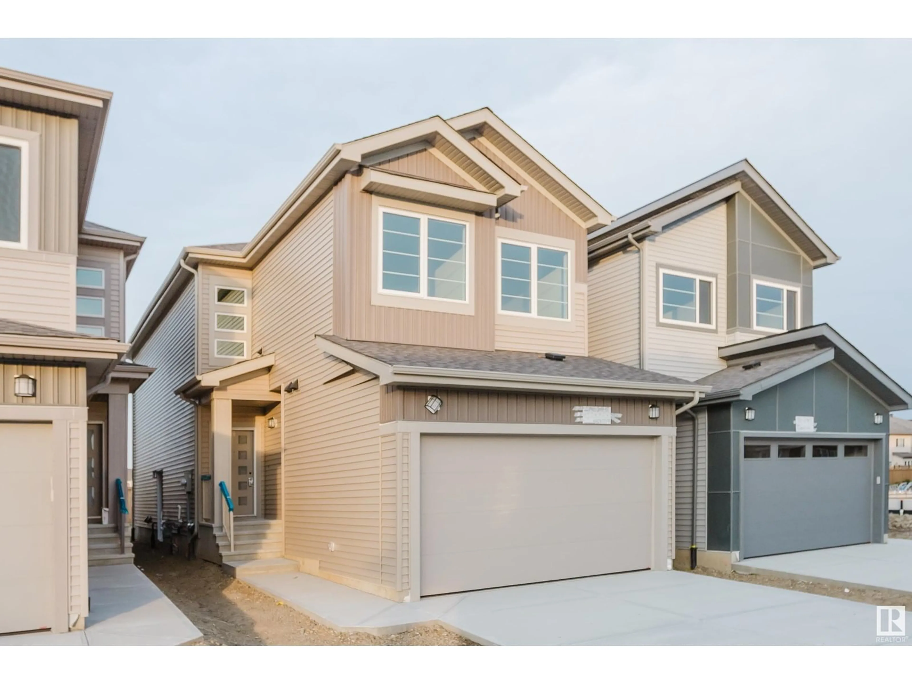 Home with vinyl exterior material, street for NW - 1965 209A ST, Edmonton Alberta T6M3C9