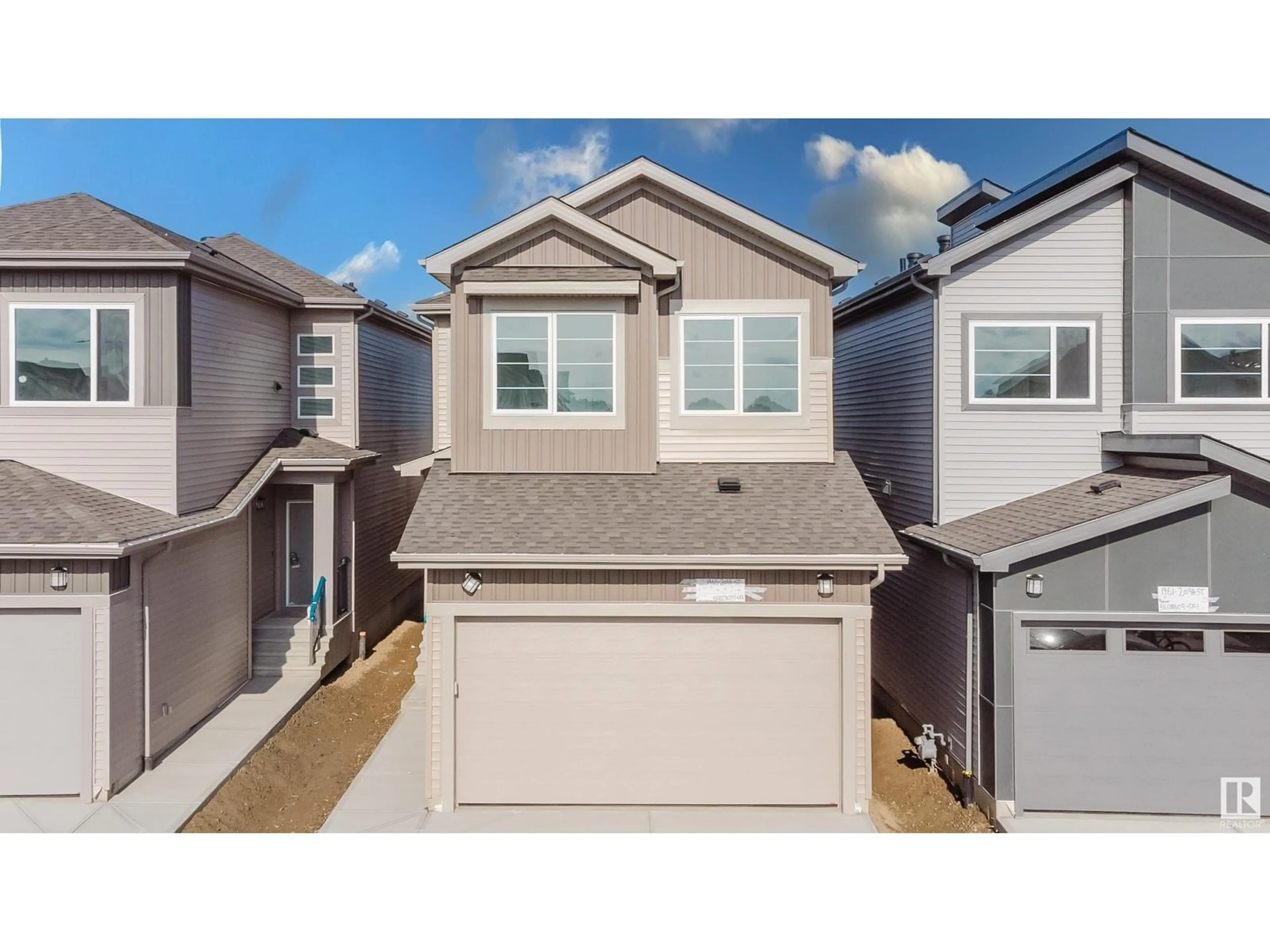 Home with vinyl exterior material, street for NW - 1965 209A ST, Edmonton Alberta T6M3C9