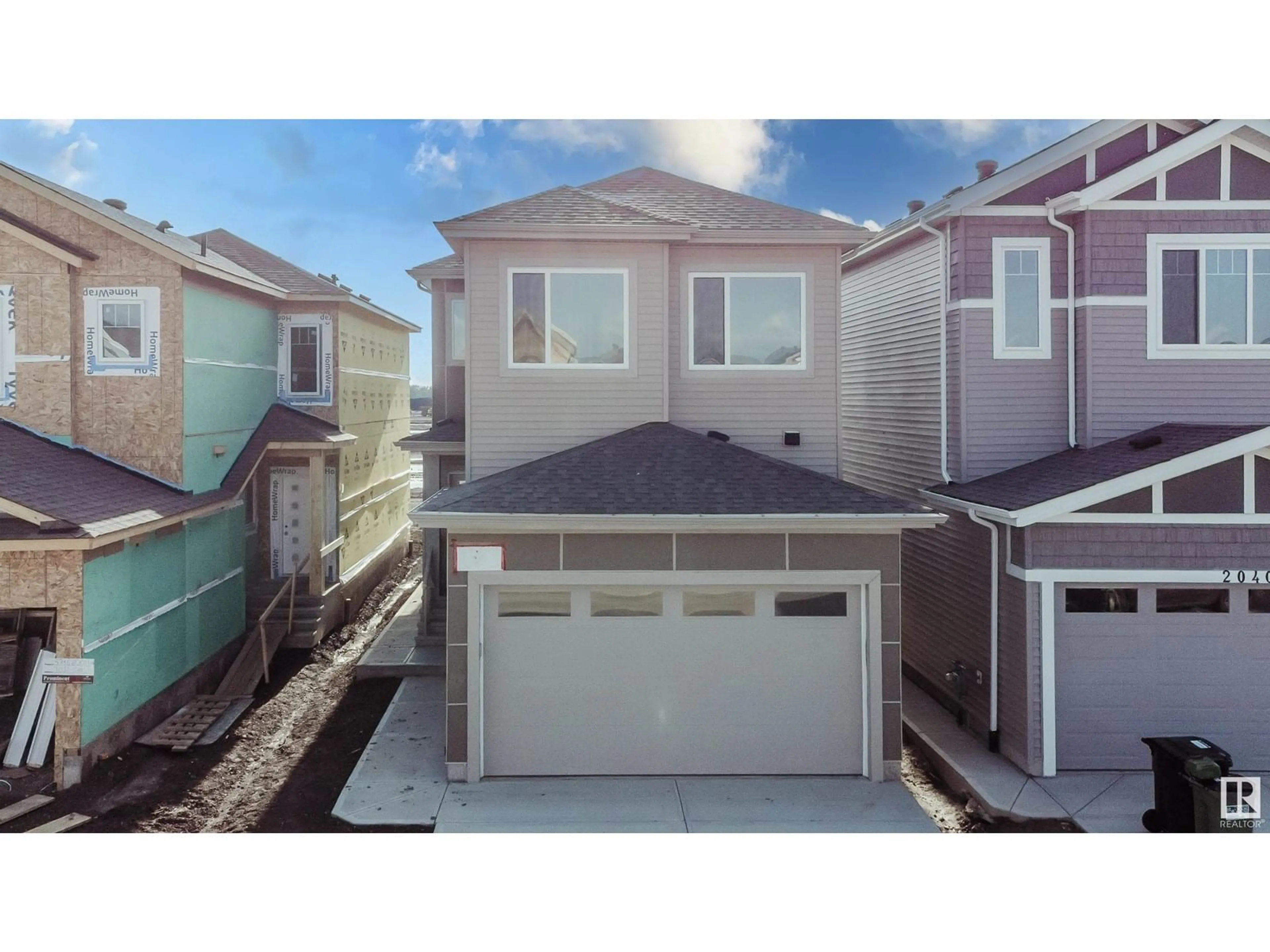 Home with vinyl exterior material, street for NW - 2036 210 ST, Edmonton Alberta T6M3H6