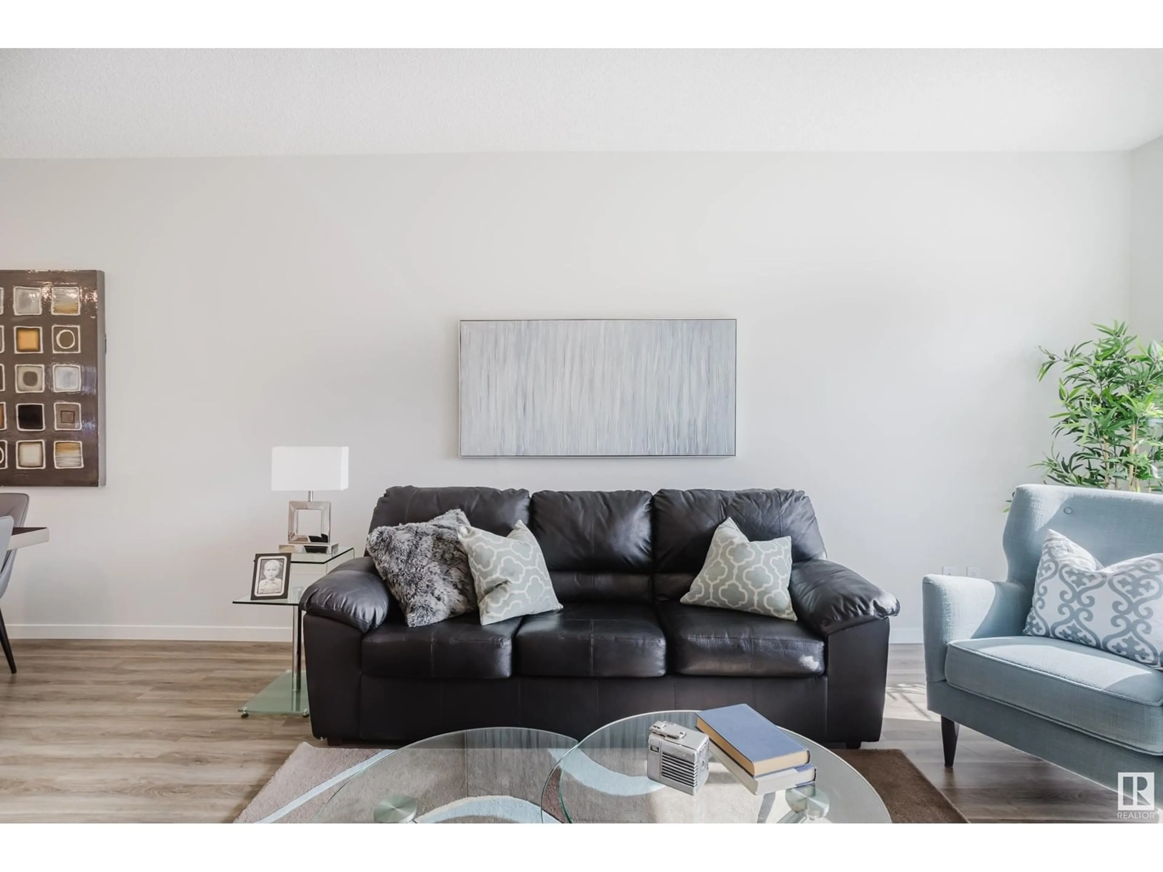 Living room with furniture, wood/laminate floor for 5210 LARK CR, Edmonton Alberta T5S0S3