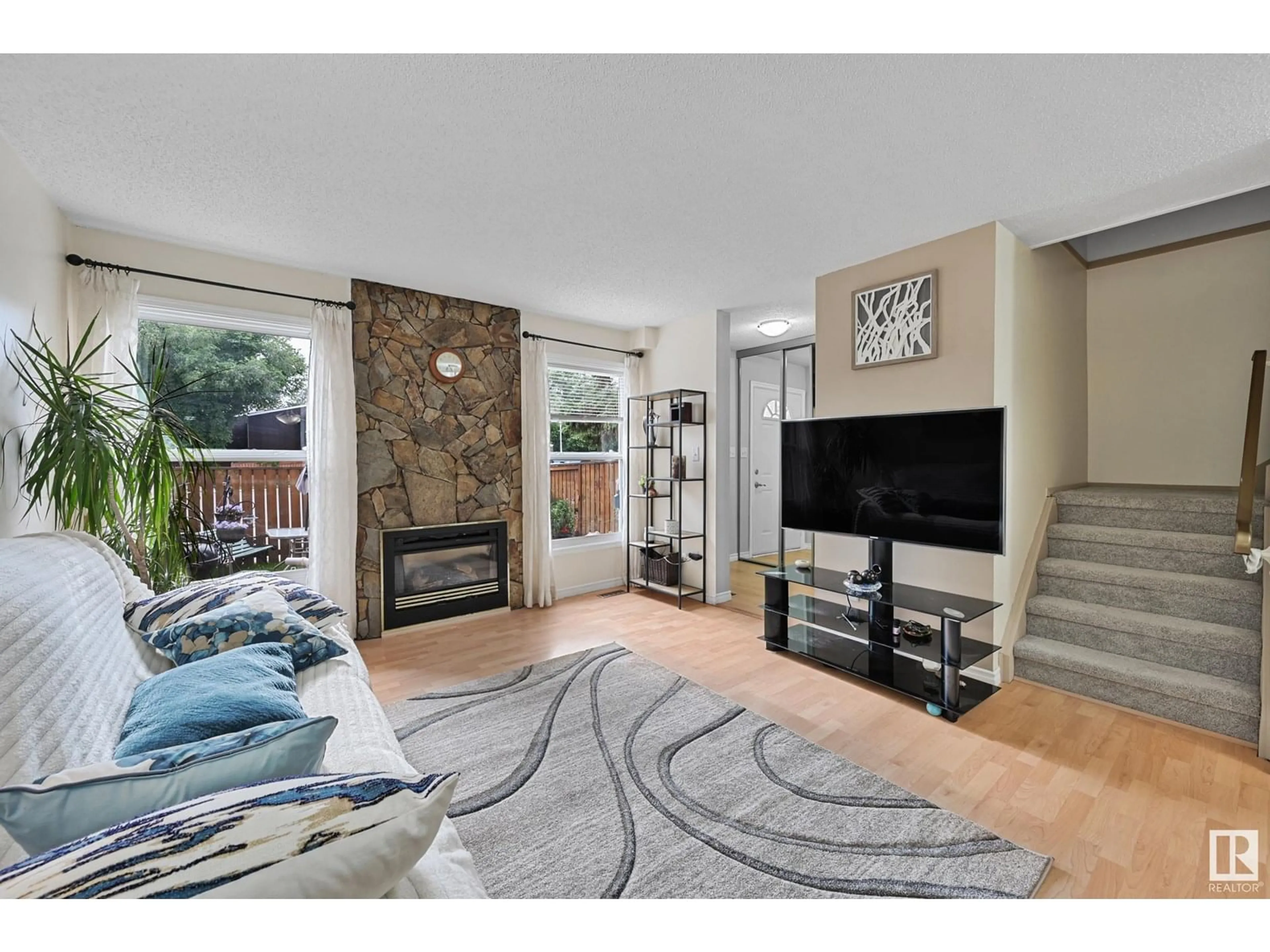 Living room with furniture, unknown for 18425 66 AV, Edmonton Alberta T5T2M1