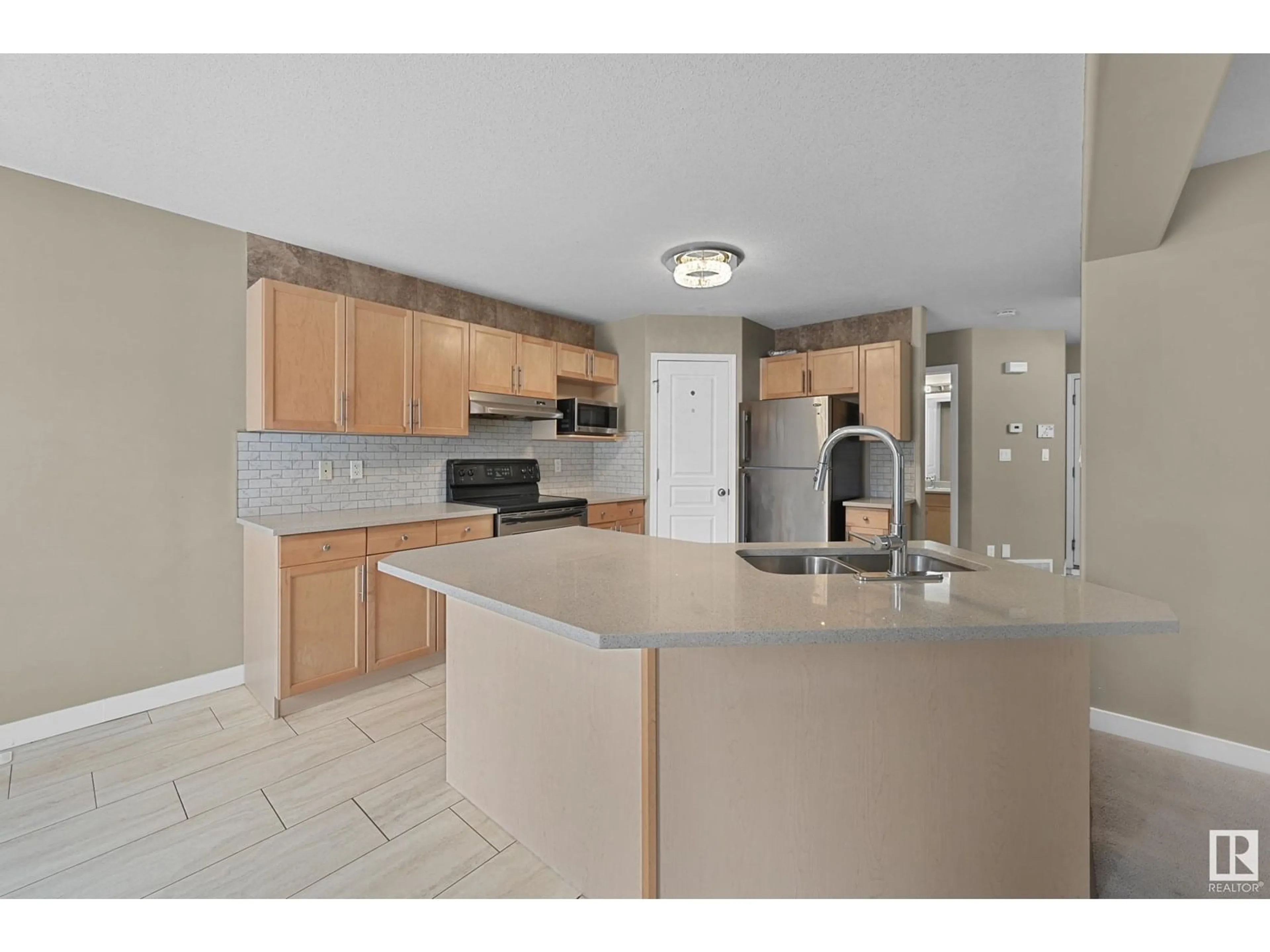 Open concept kitchen, ceramic/tile floor for 638 LEGER WY, Edmonton Alberta T6R0C1