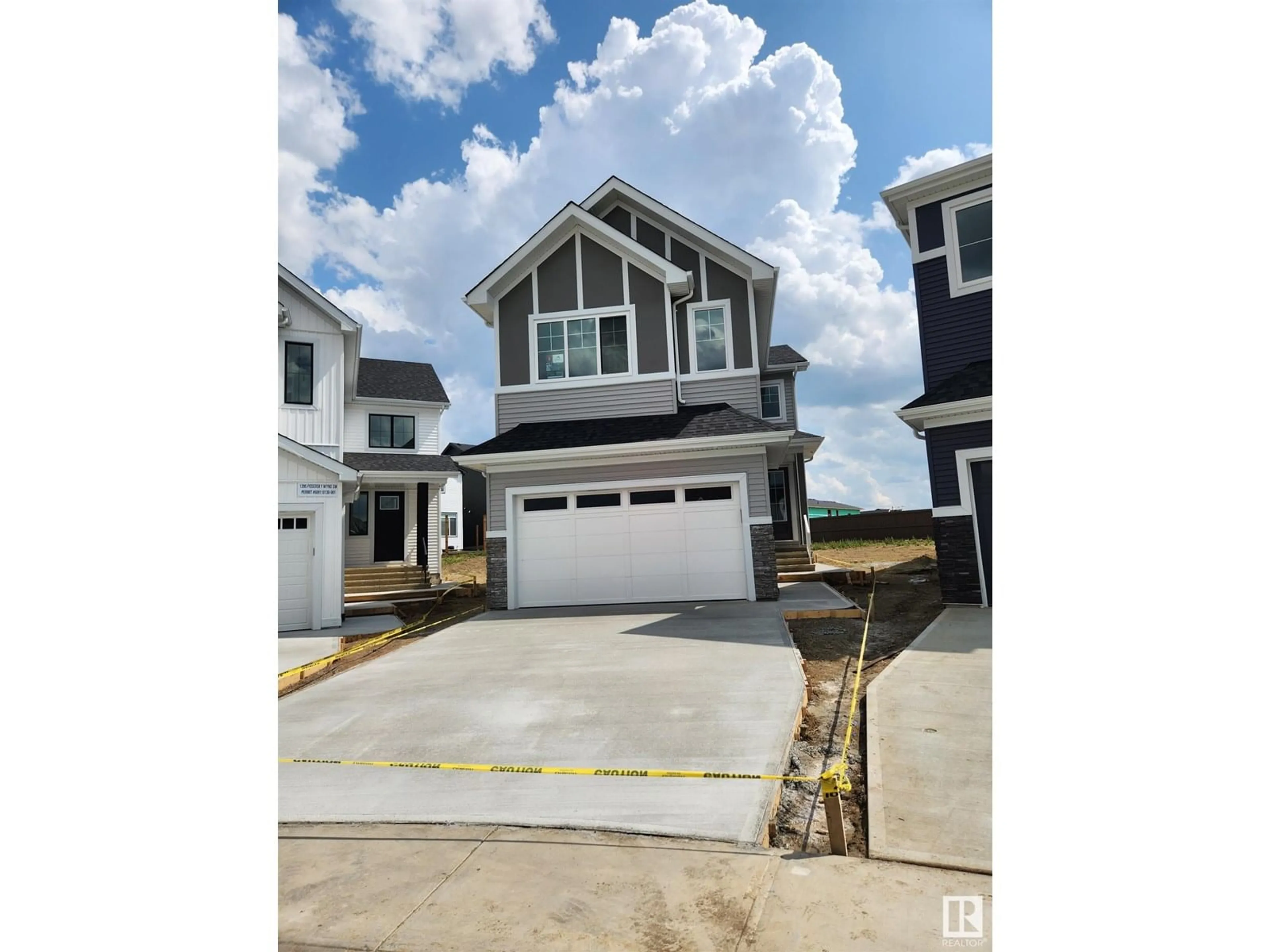 Home with vinyl exterior material, street for SW - 1297 PODERSKY WD, Edmonton Alberta T6E5E4