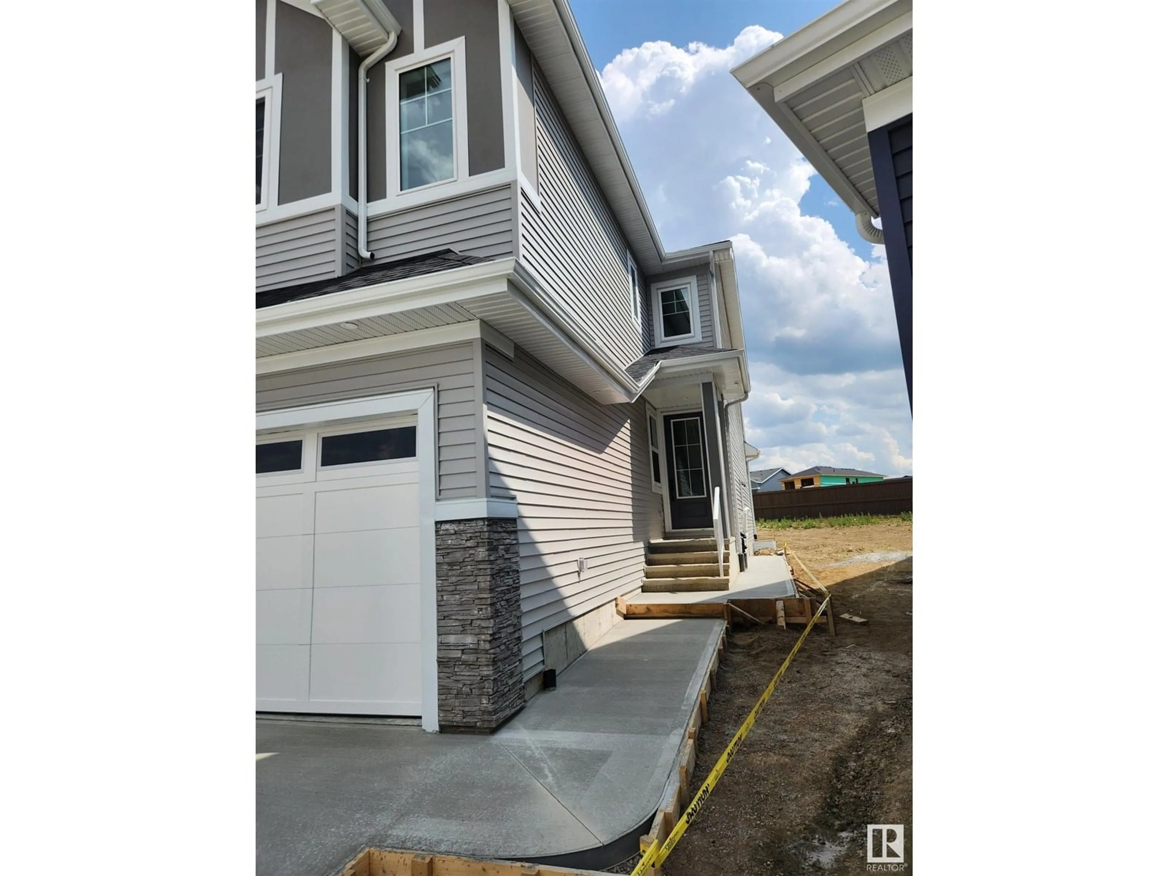 Home with vinyl exterior material, street for SW - 1297 PODERSKY WD, Edmonton Alberta T6E5E4