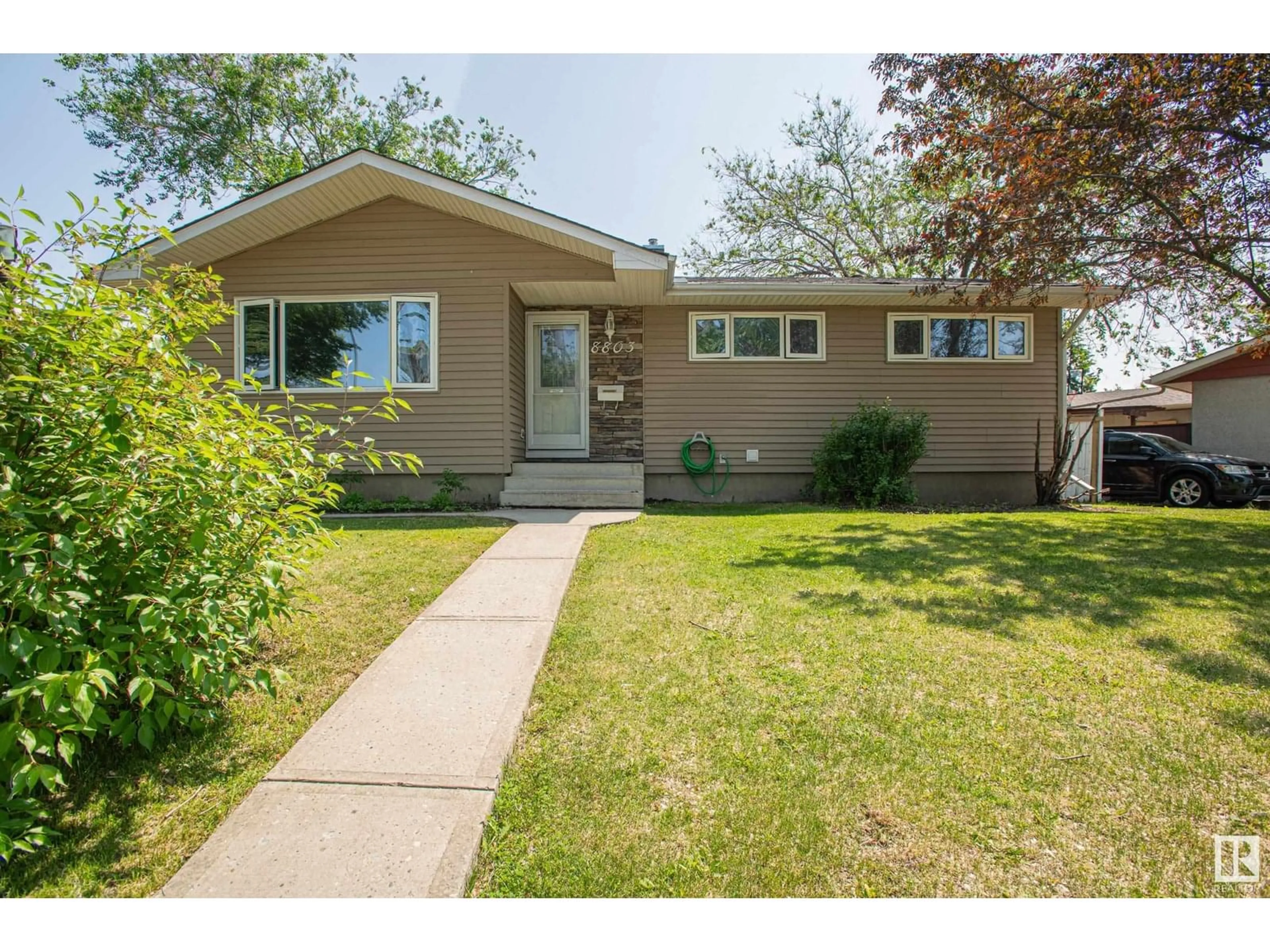 Home with vinyl exterior material, street for NW - 8803 160 ST, Edmonton Alberta T5R2H6