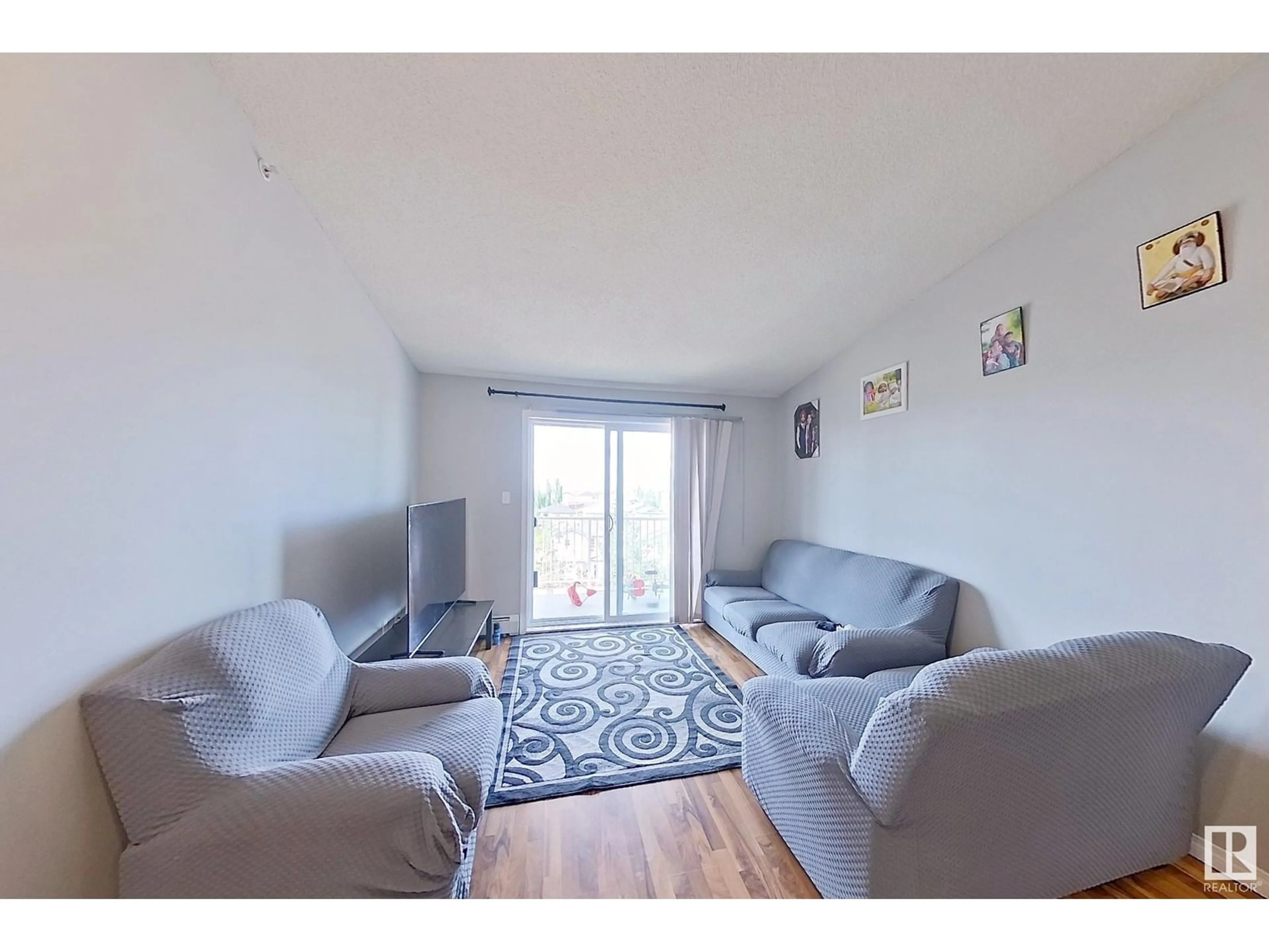 Living room with furniture, unknown for 418 - 3425 19 ST NW, Edmonton Alberta T6T2B5